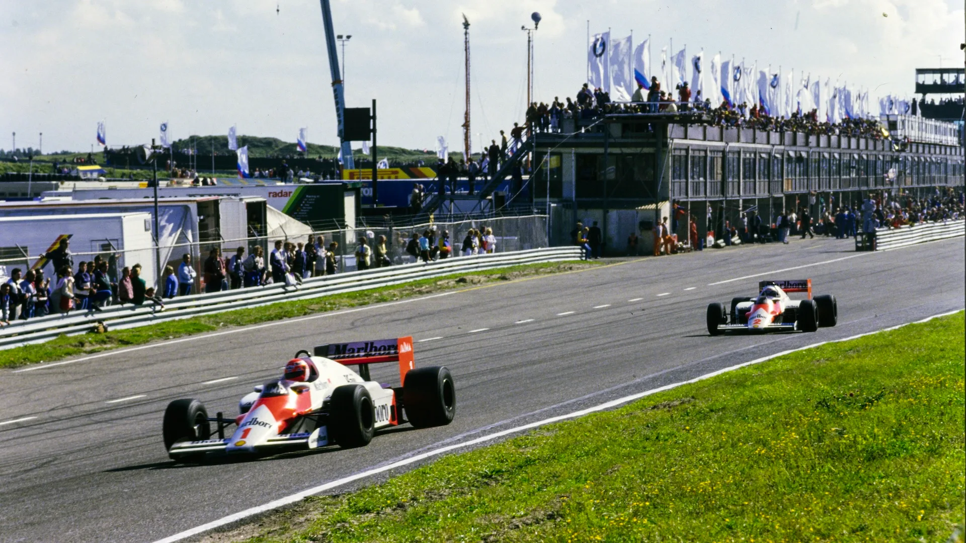 ZANDVOORT, NETHERLANDS - AUGUST 25: Niki Lauda, McLaren MP4-2B TAG, leads Alain Prost, McLaren