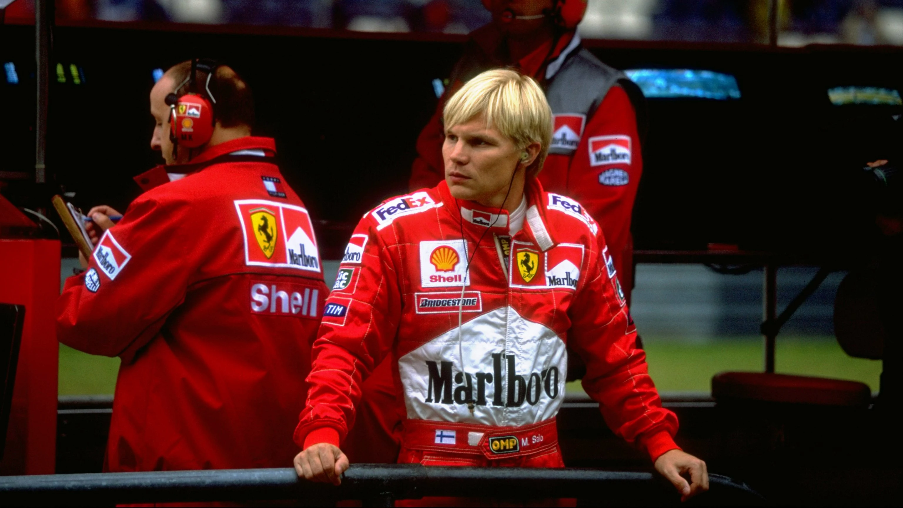 26 Sep 1999:  Mika Salo of Finland stands in the Ferrari pits before the European Grand Prix held