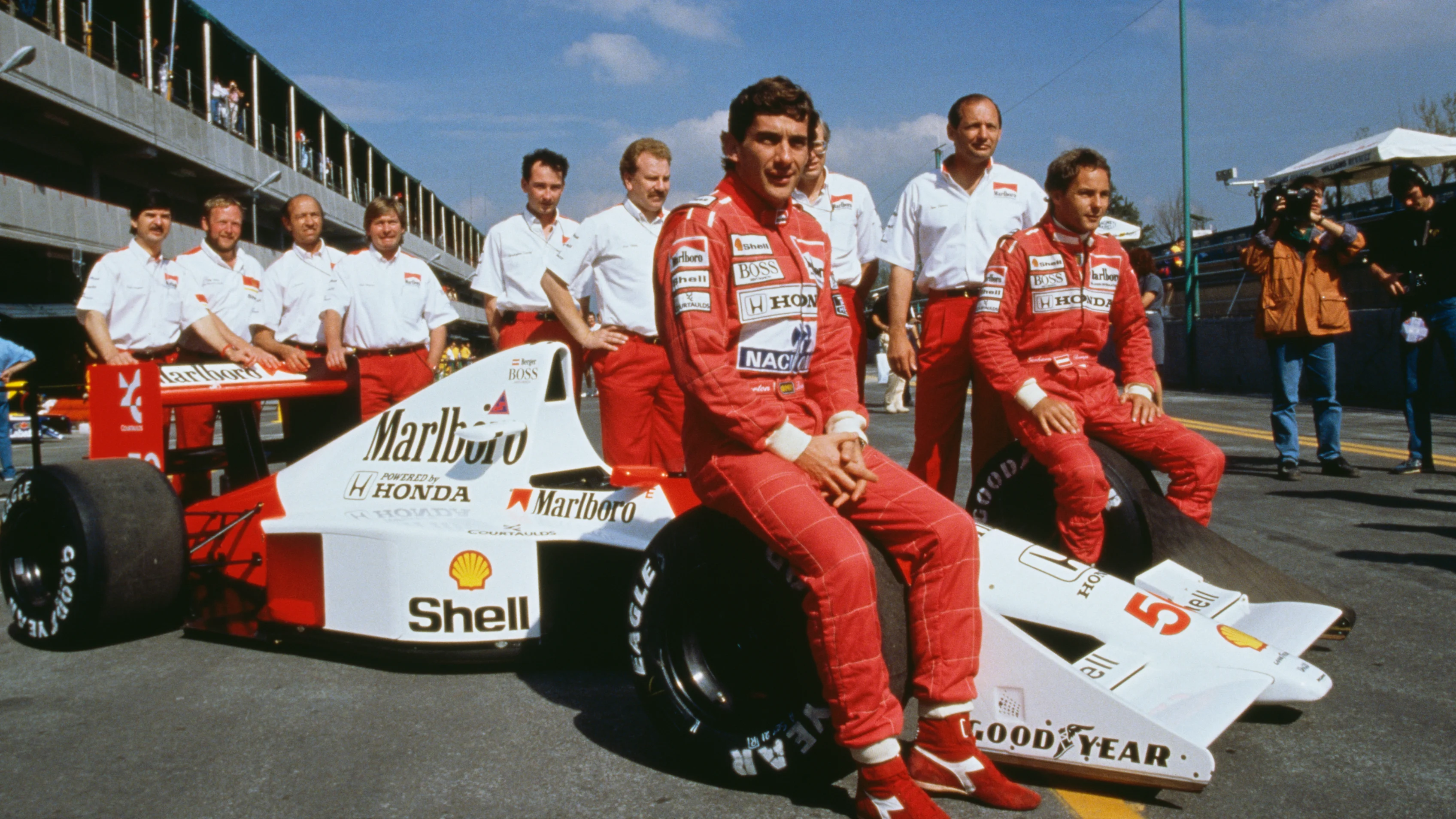 Brazilian racing driver Ayrton Senna (1960 -1994, centre) and his Austrian teammate Gerhard Berger