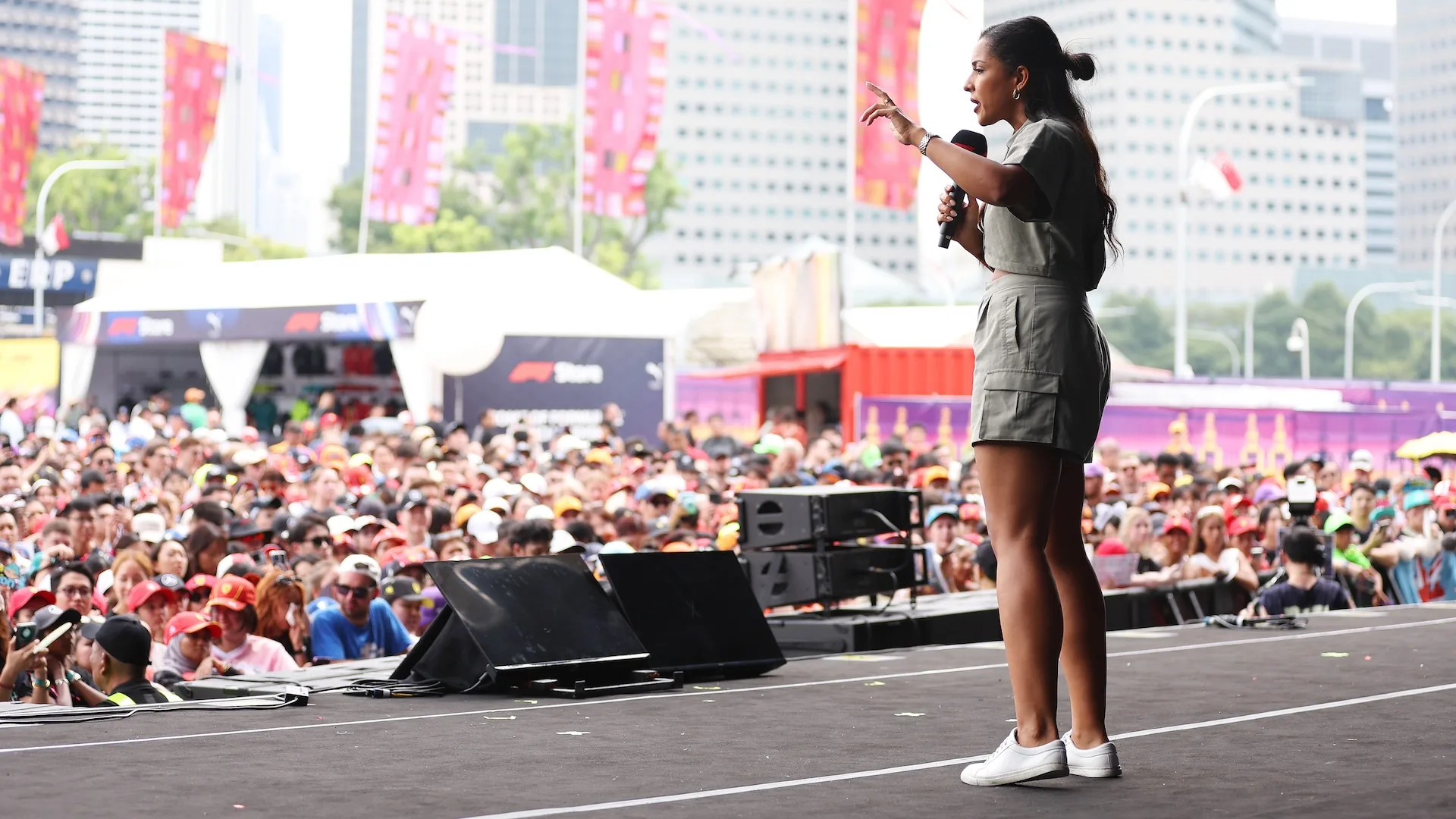 SINGAPORE, SINGAPORE - SEPTEMBER 21: Ariana Bravo talks to the crowd on the fan stage prior to