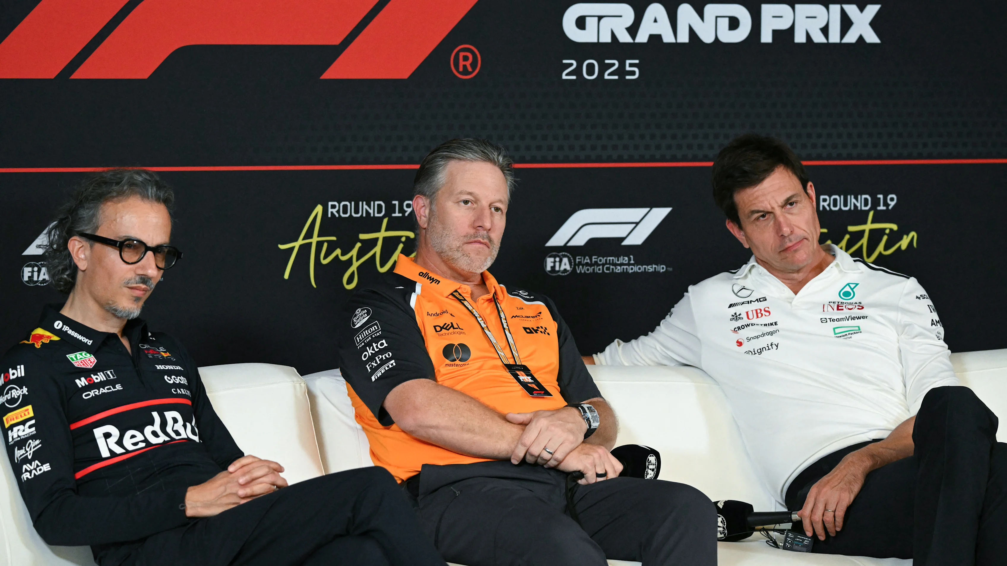 (L/R) Red Bull Racing's team principal Laurent Mekies, McLaren's CEO Zak Brown, and Mercedes'