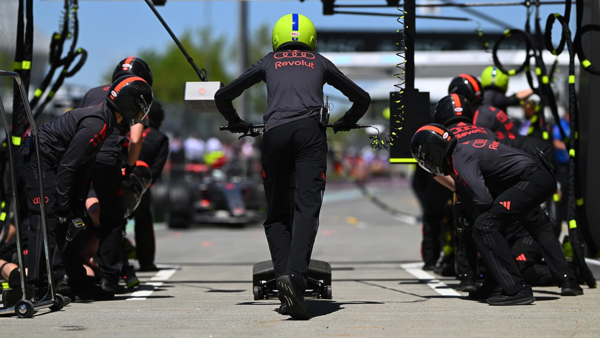 MONTREAL, QUEBEC - MAY 22: The Audi F1 Team pit crew ready for a stop during practice ahead of the