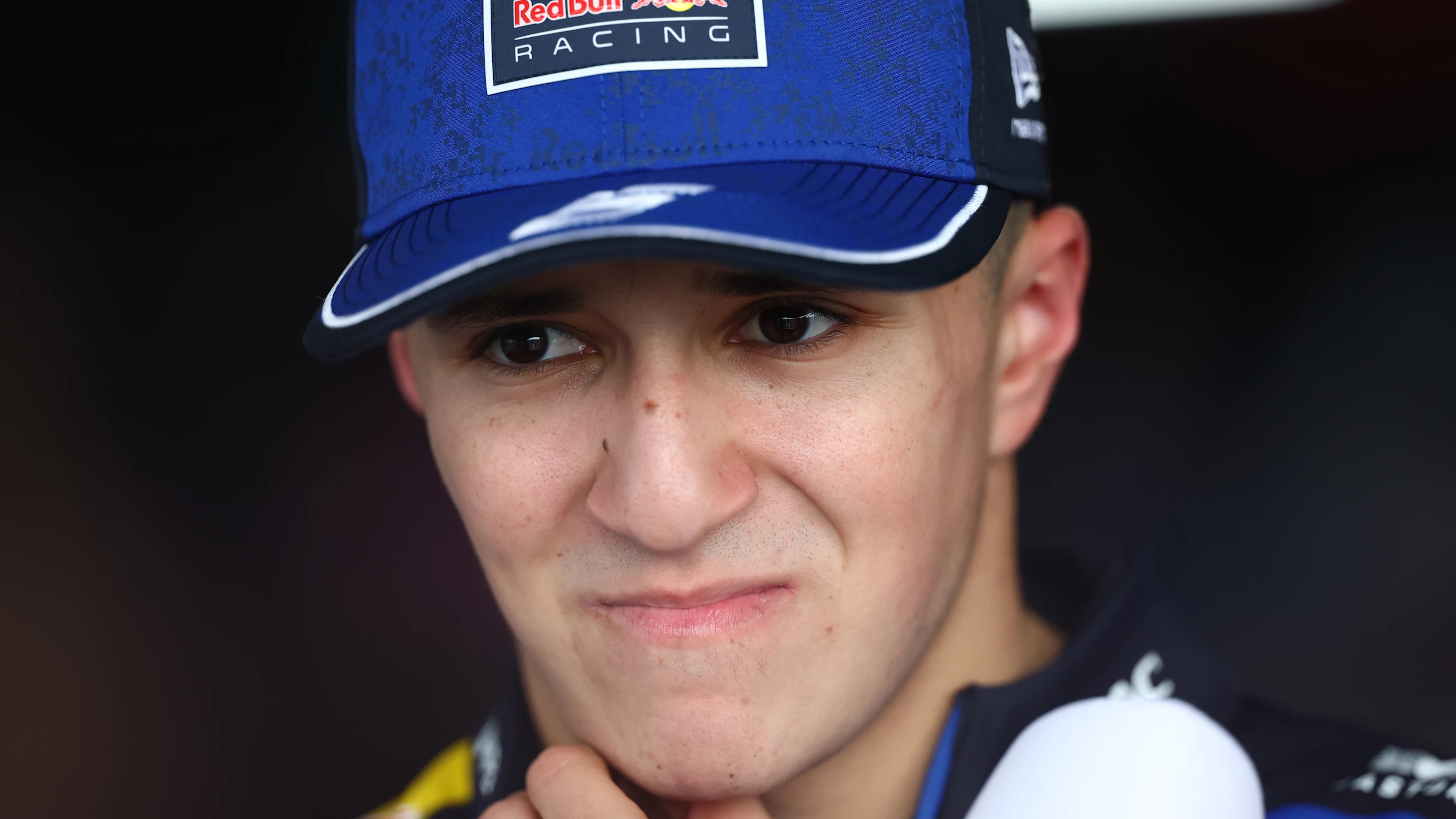 SUZUKA, JAPAN - MARCH 29: Isack Hadjar of France and Oracle Red Bull Racing looks on in the garage