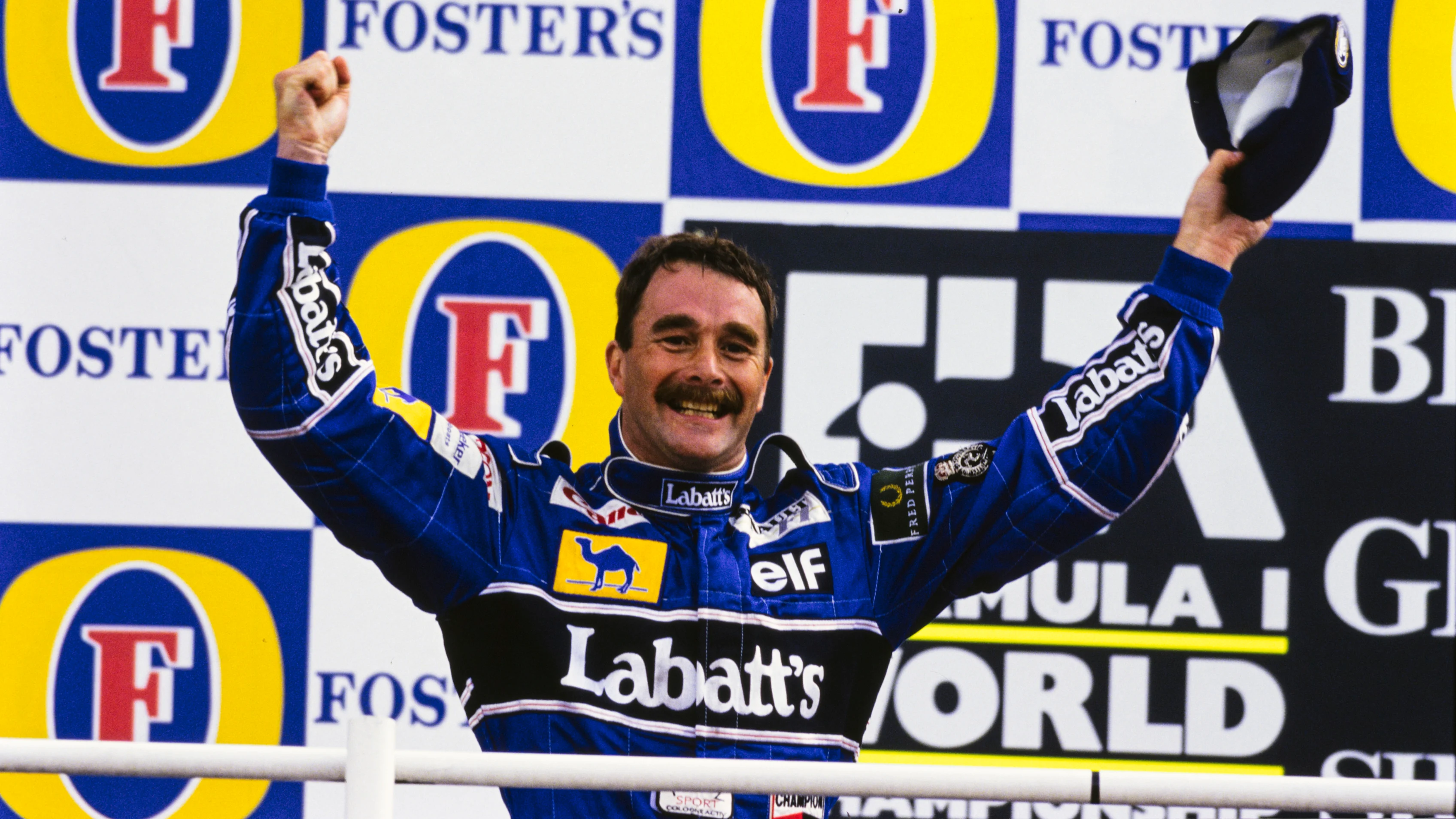 SILVERSTONE, UNITED KINGDOM - JULY 12: Nigel Mansell, 1st position, celebrates on the podium after