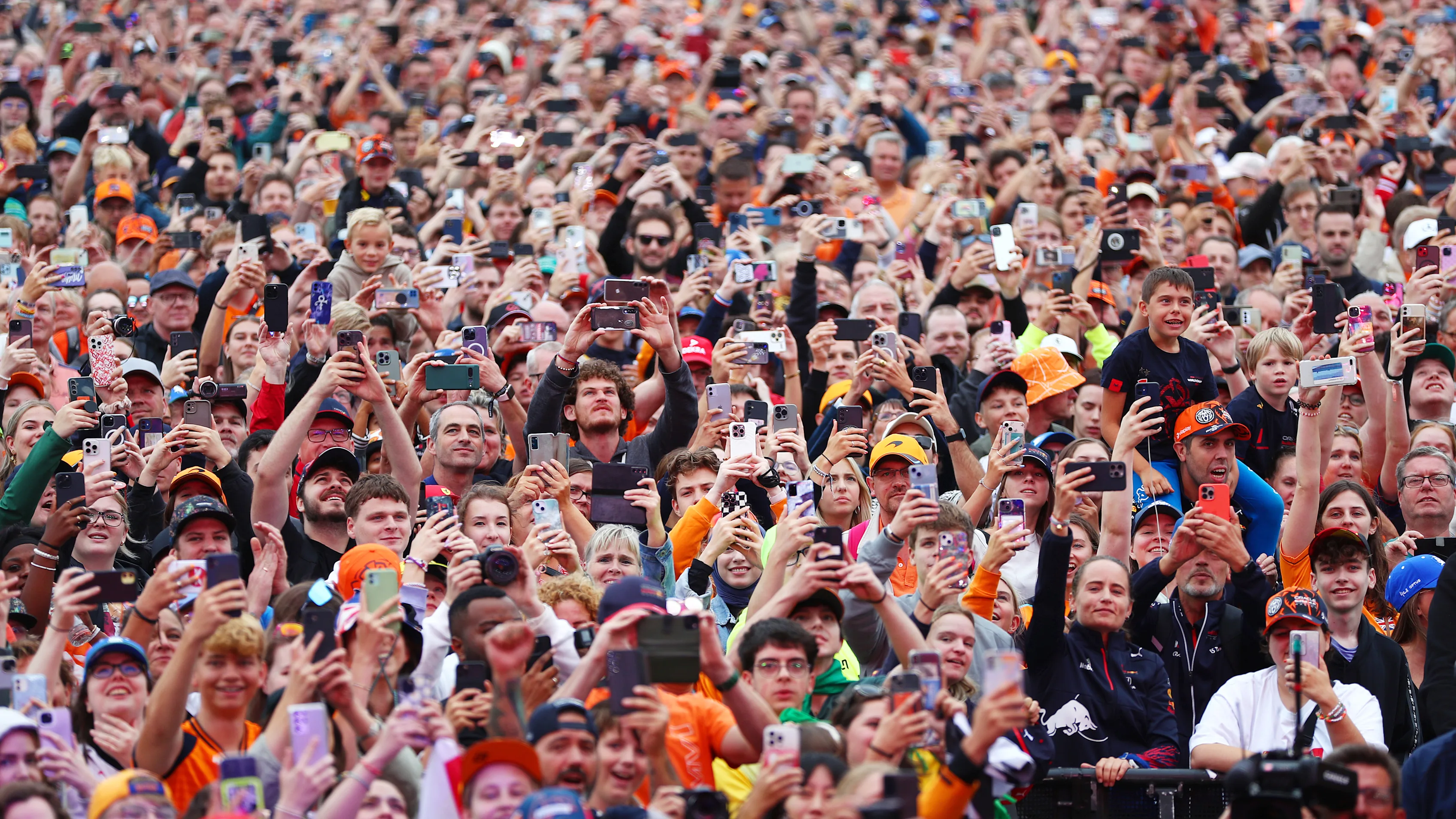 ZANDVOORT, NETHERLANDS - AUGUST 23: A general view as fans are seen using their phones at the fan