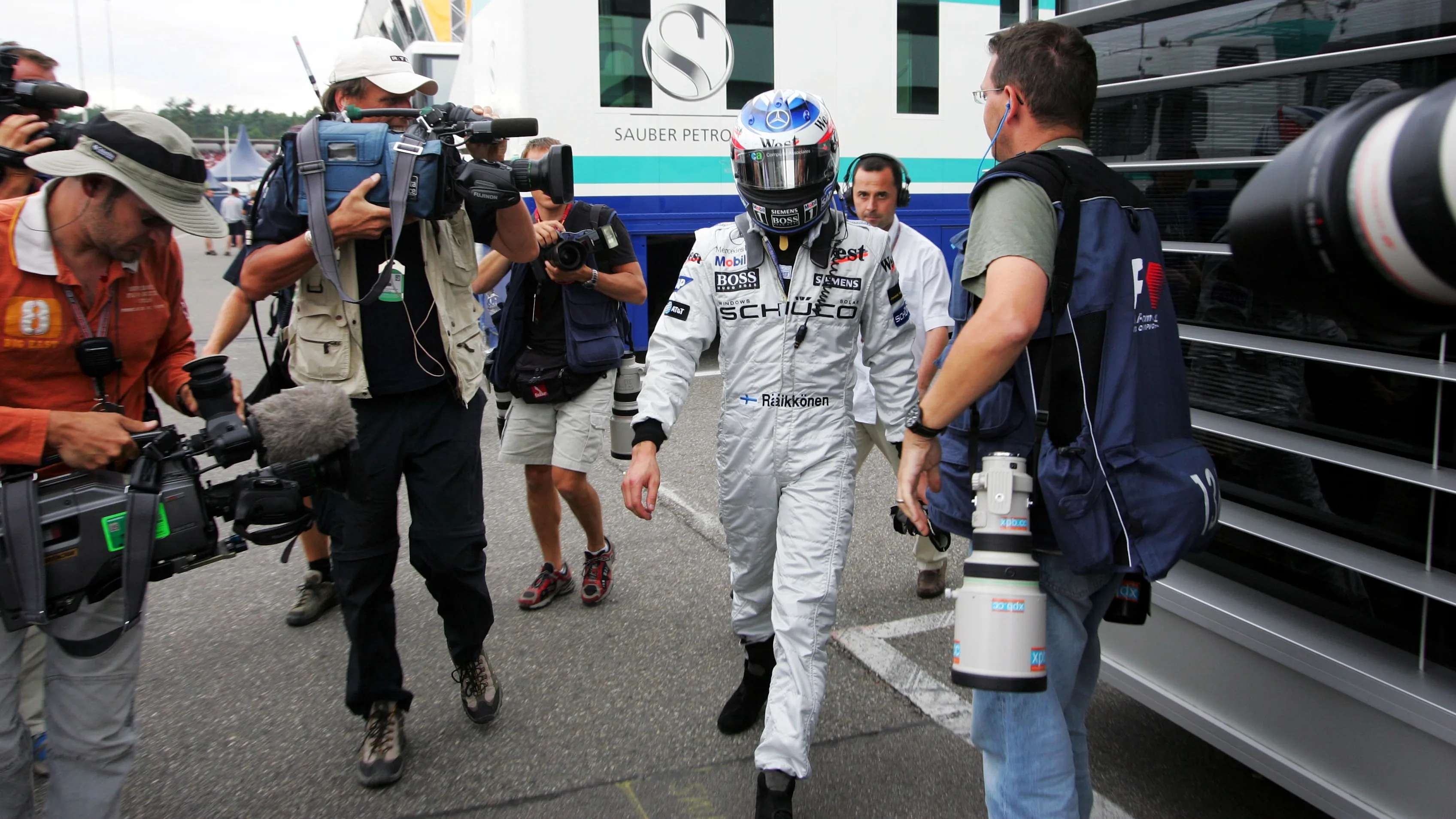 Kimi Raikkonen (FIN) McLaren walks into the McLaren motorhome after retiring from the lead of the