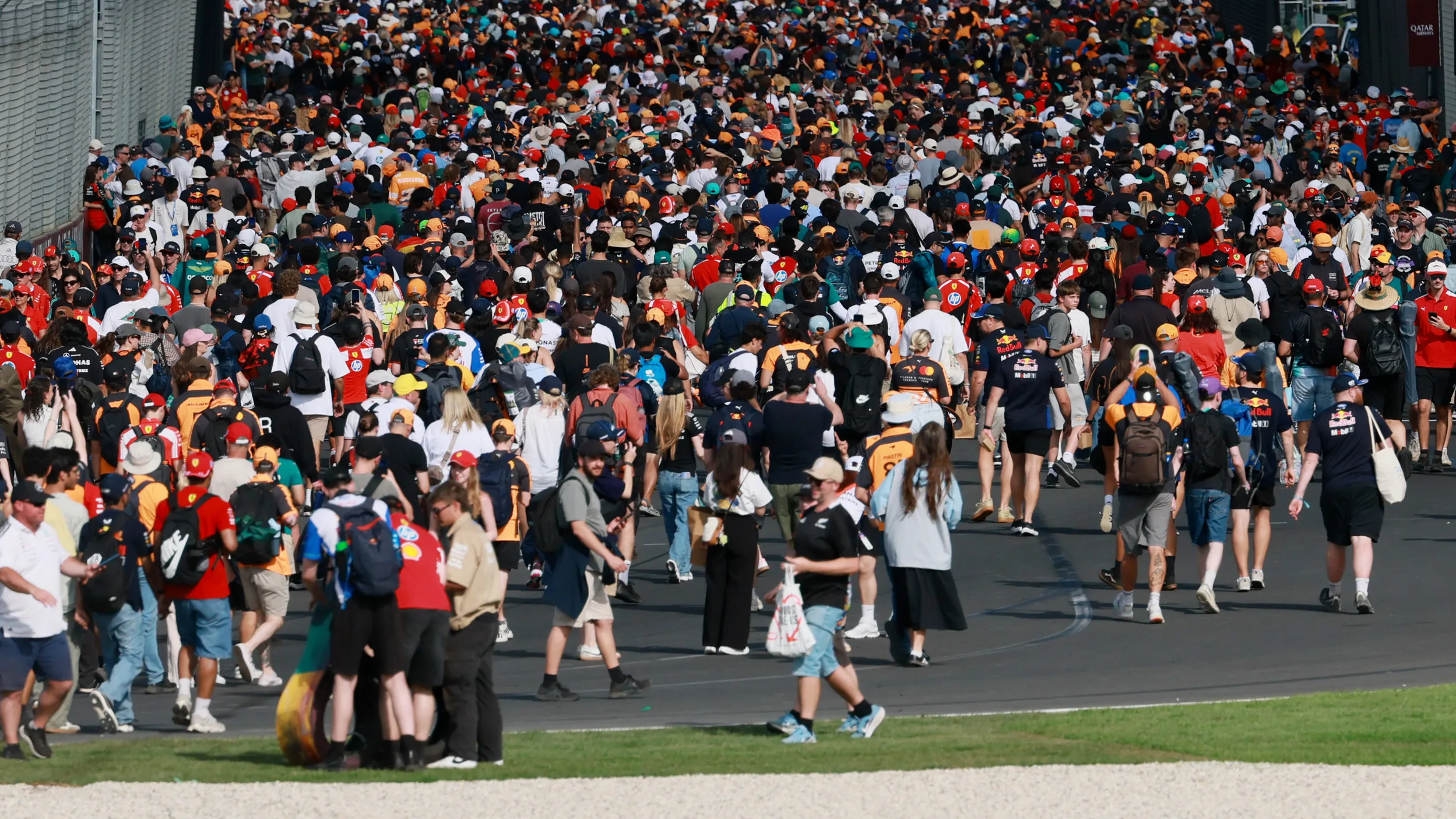 MELBOURNE, AUSTRALIA - MARCH 08: Fans invade the circuit for the podium ceremony during the F1