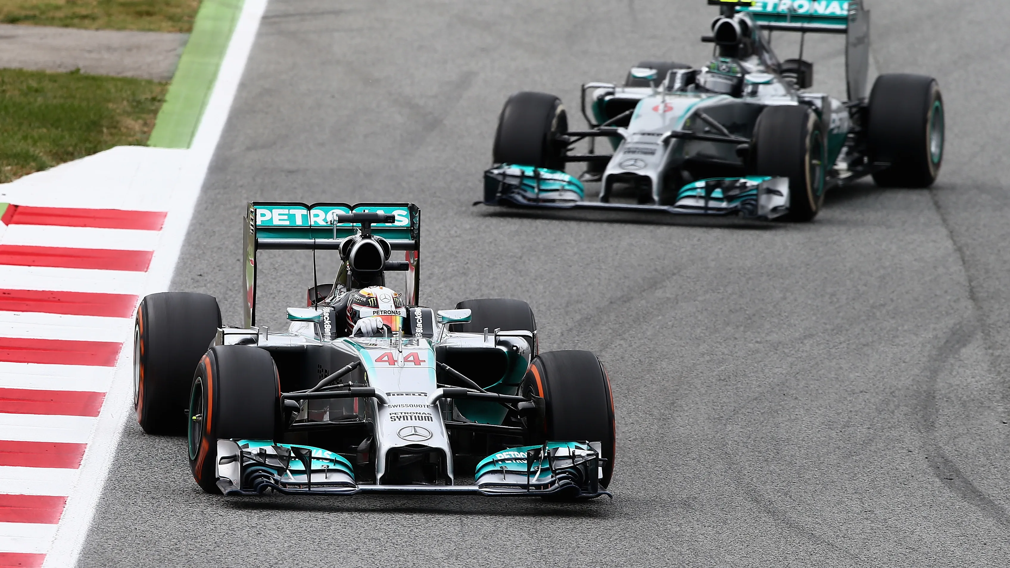 MONTMELO, SPAIN - MAY 11:  Lewis Hamilton of Great Britain and Mercedes GP leads Nico Rosberg of