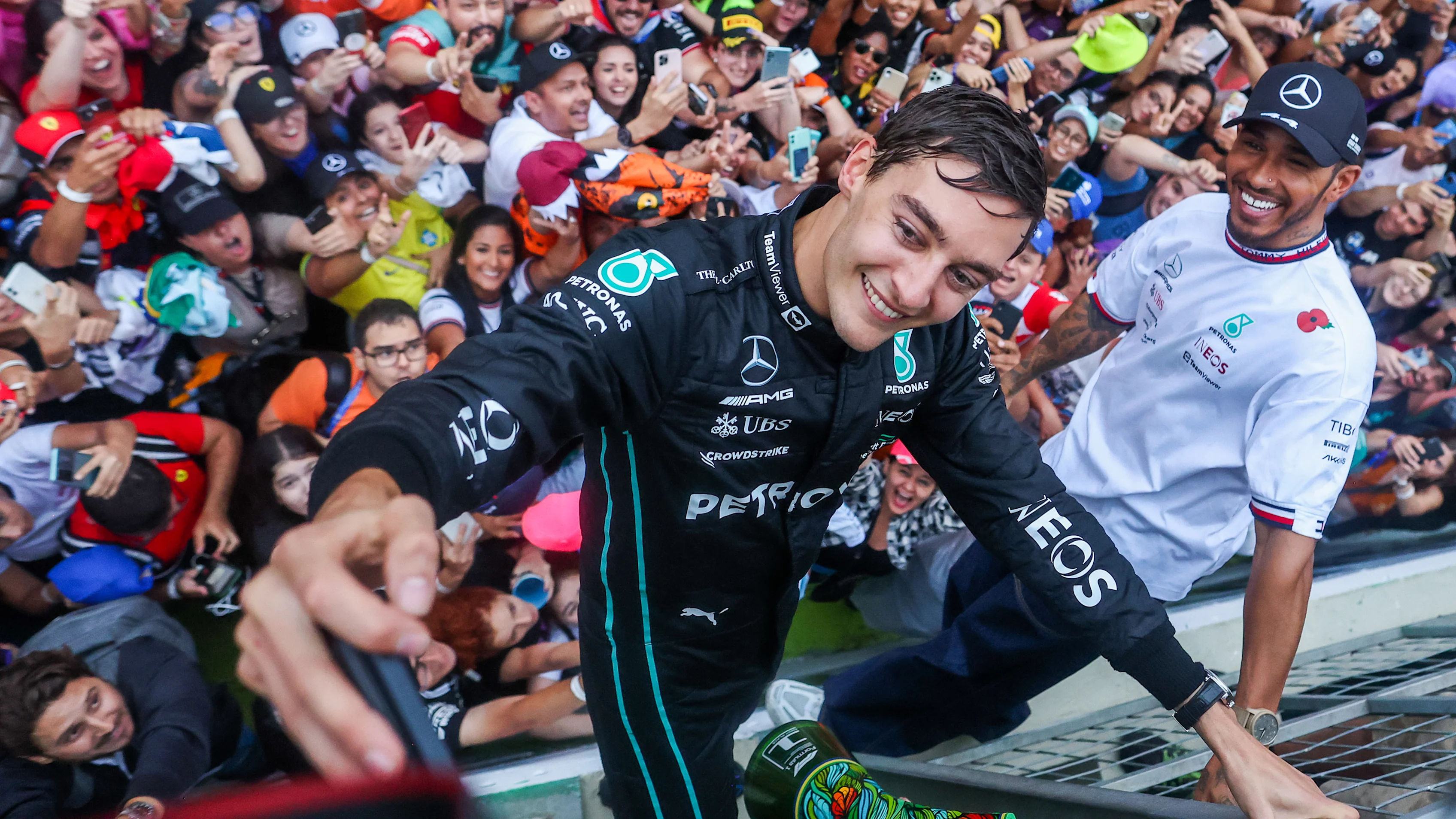 SAO PAULO, BRAZIL - NOVEMBER 13: George Russell of Mercedes and Great Britain and Lewis Hamilton of