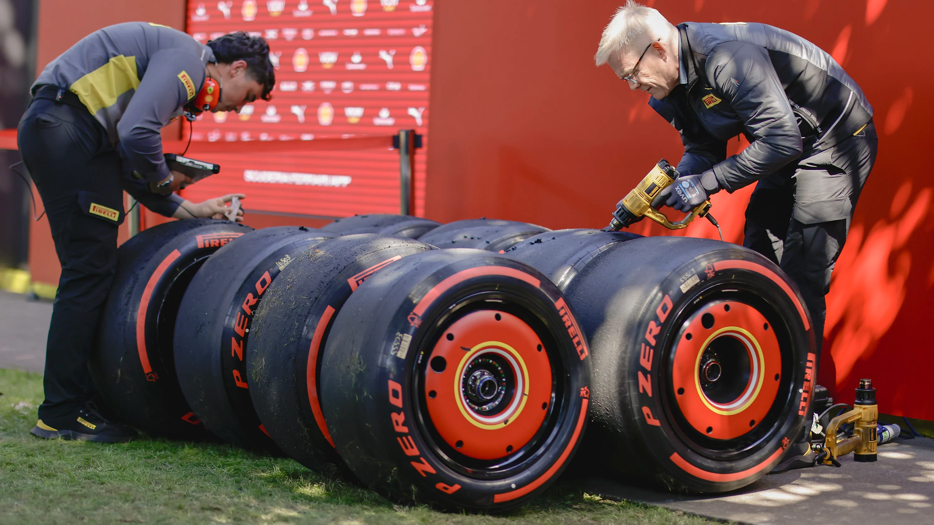 MELBOURNE, AUSTRALIA - MARCH 22: Pirelli team members work on tires during practice ahead of the F1