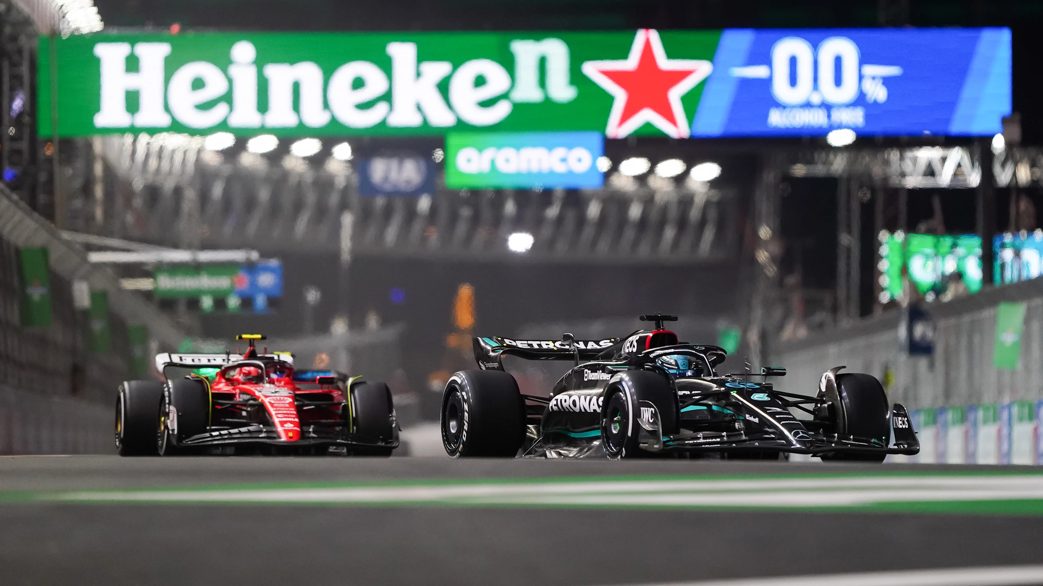 LAS VEGAS, NEVADA - NOVEMBER 18: George Russell of Great Britain and Mercedes and Charles Leclerc