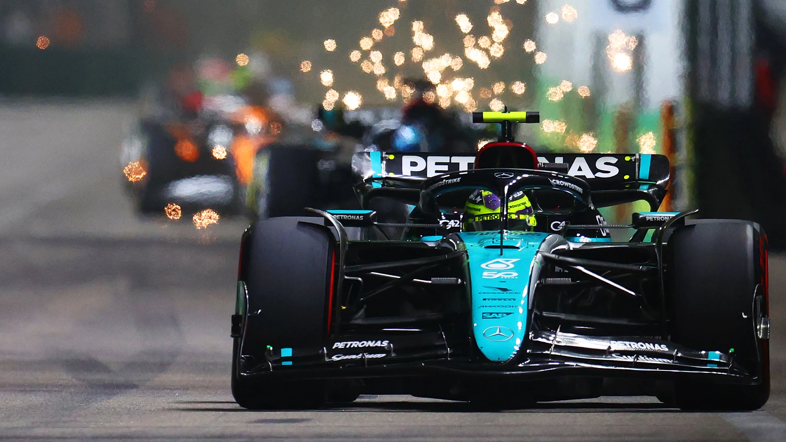 SINGAPORE, SINGAPORE - SEPTEMBER 22: Lewis Hamilton of Great Britain driving the (44) Mercedes AMG