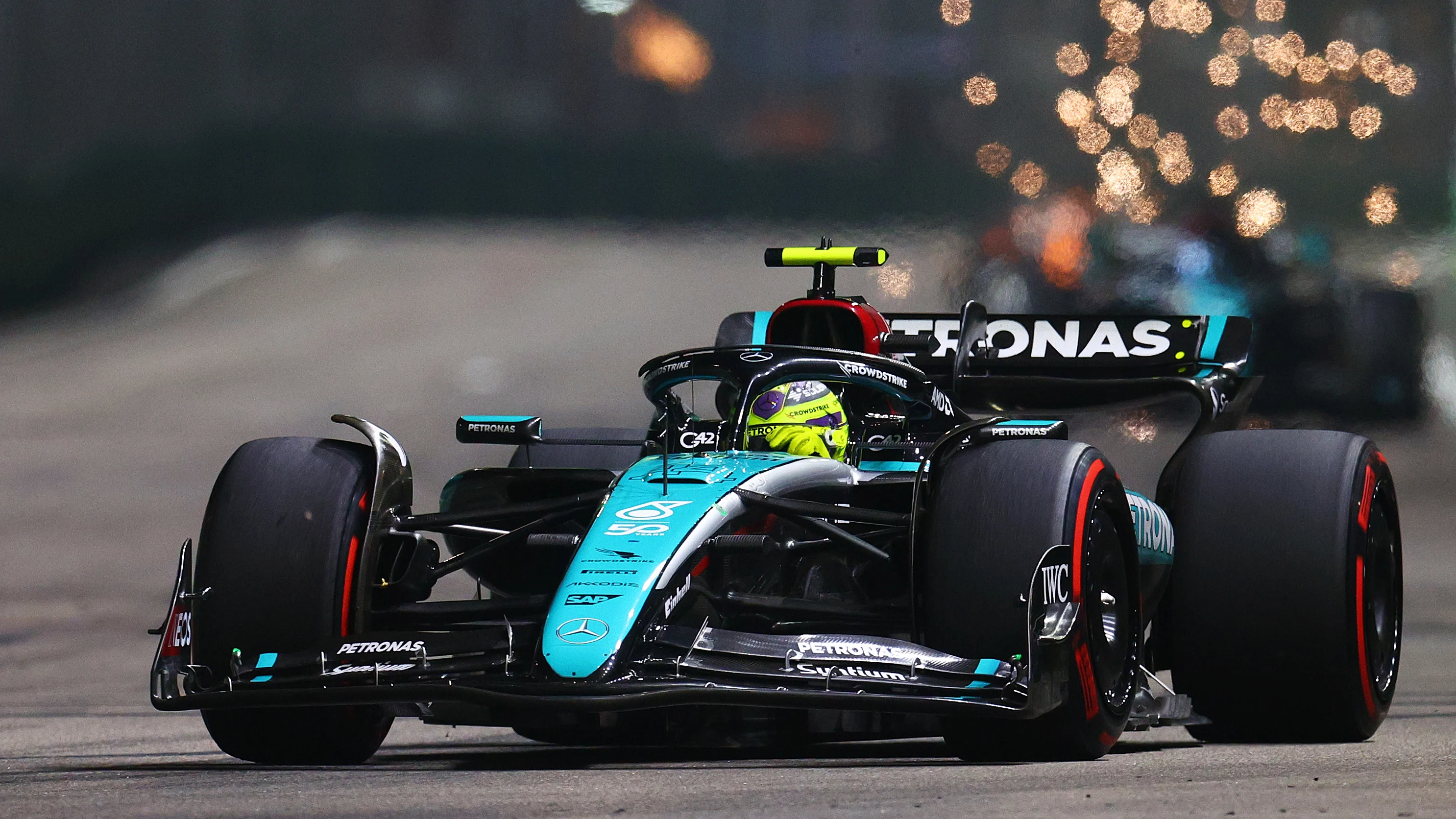 SINGAPORE, SINGAPORE - SEPTEMBER 22: Lewis Hamilton of Great Britain driving the (44) Mercedes AMG