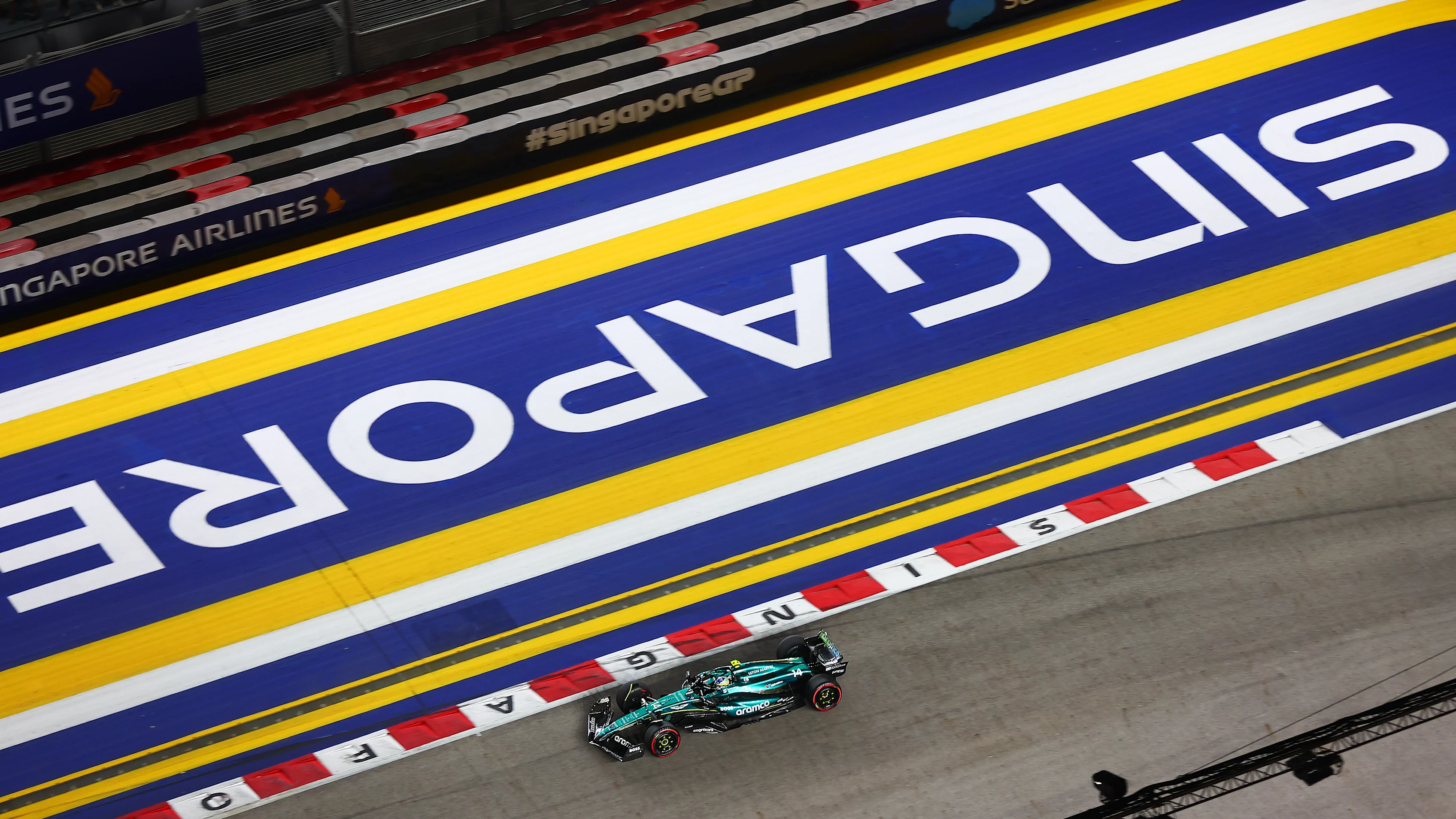 SINGAPORE, SINGAPORE - SEPTEMBER 20: Fernando Alonso of Spain driving the (14) Aston Martin AMR24 Mercedes on track during practice ahead of the F1 Grand Prix of Singapore at Marina Bay Street Circuit on September 20, 2024 in Singapore, Singapore. (Photo by Joe Portlock/Getty Images)