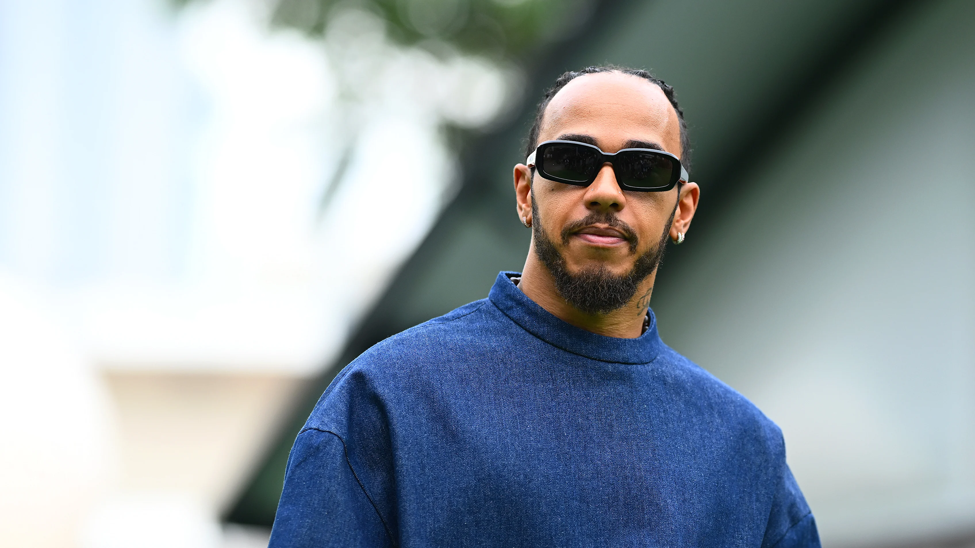 SINGAPORE, SINGAPORE - SEPTEMBER 19: Lewis Hamilton of Great Britain and Mercedes walks in the