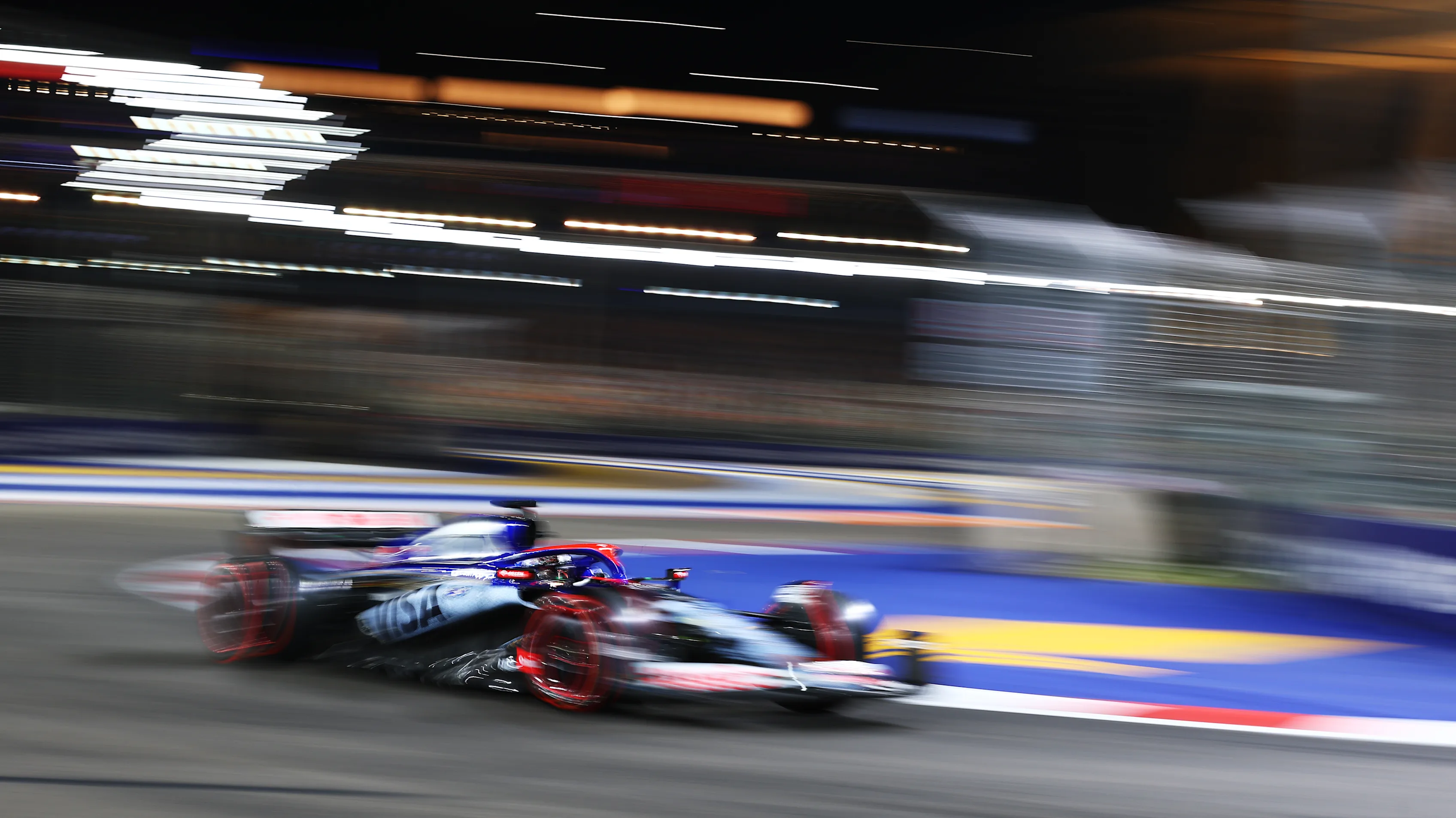 SINGAPORE, SINGAPORE - SEPTEMBER 21: Daniel Ricciardo of Australia driving the (3) Visa Cash App RB