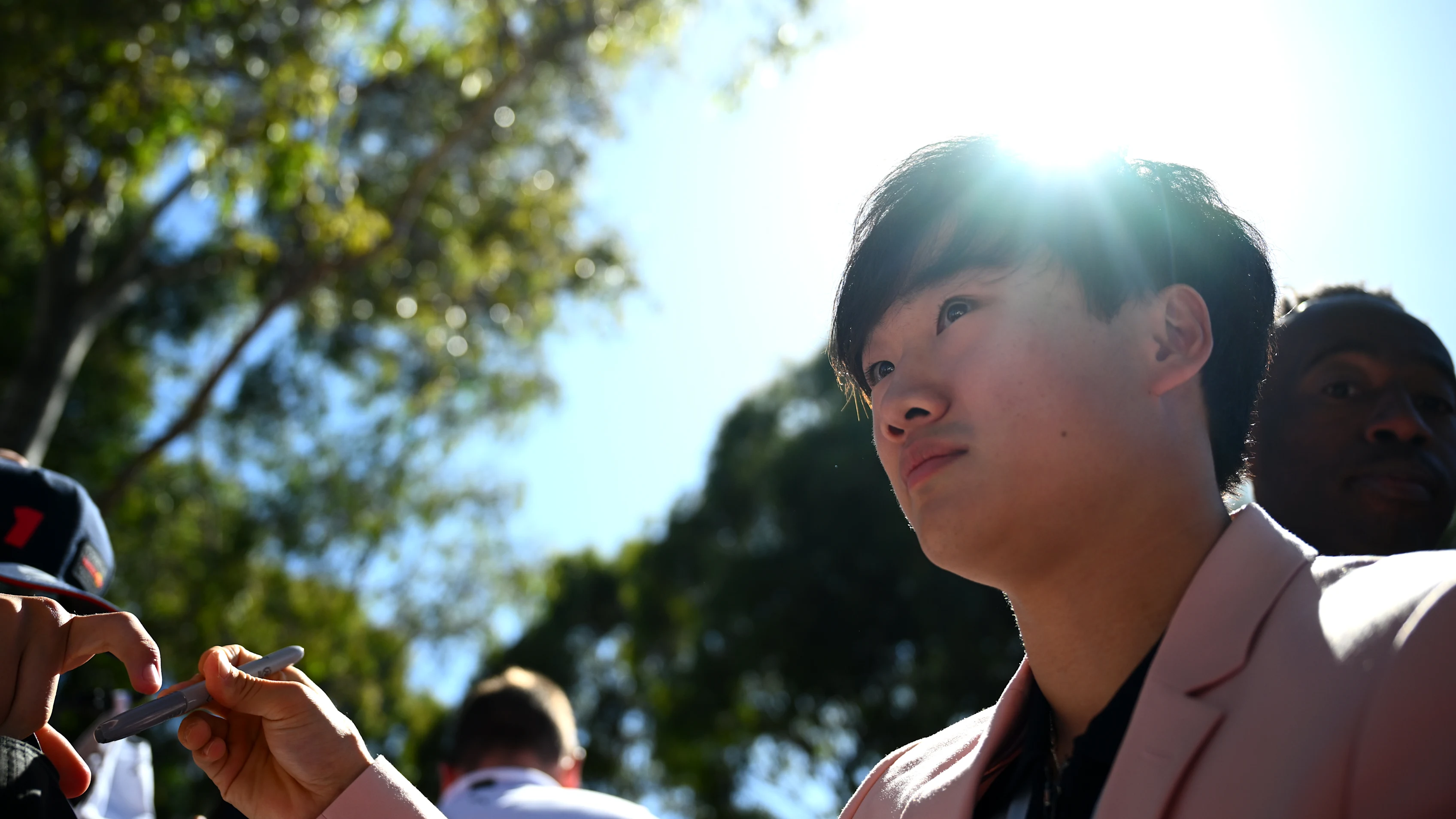 MELBOURNE, AUSTRALIA - MARCH 21: Yuki Tsunoda of Japan and Visa Cash App RB arrives on the