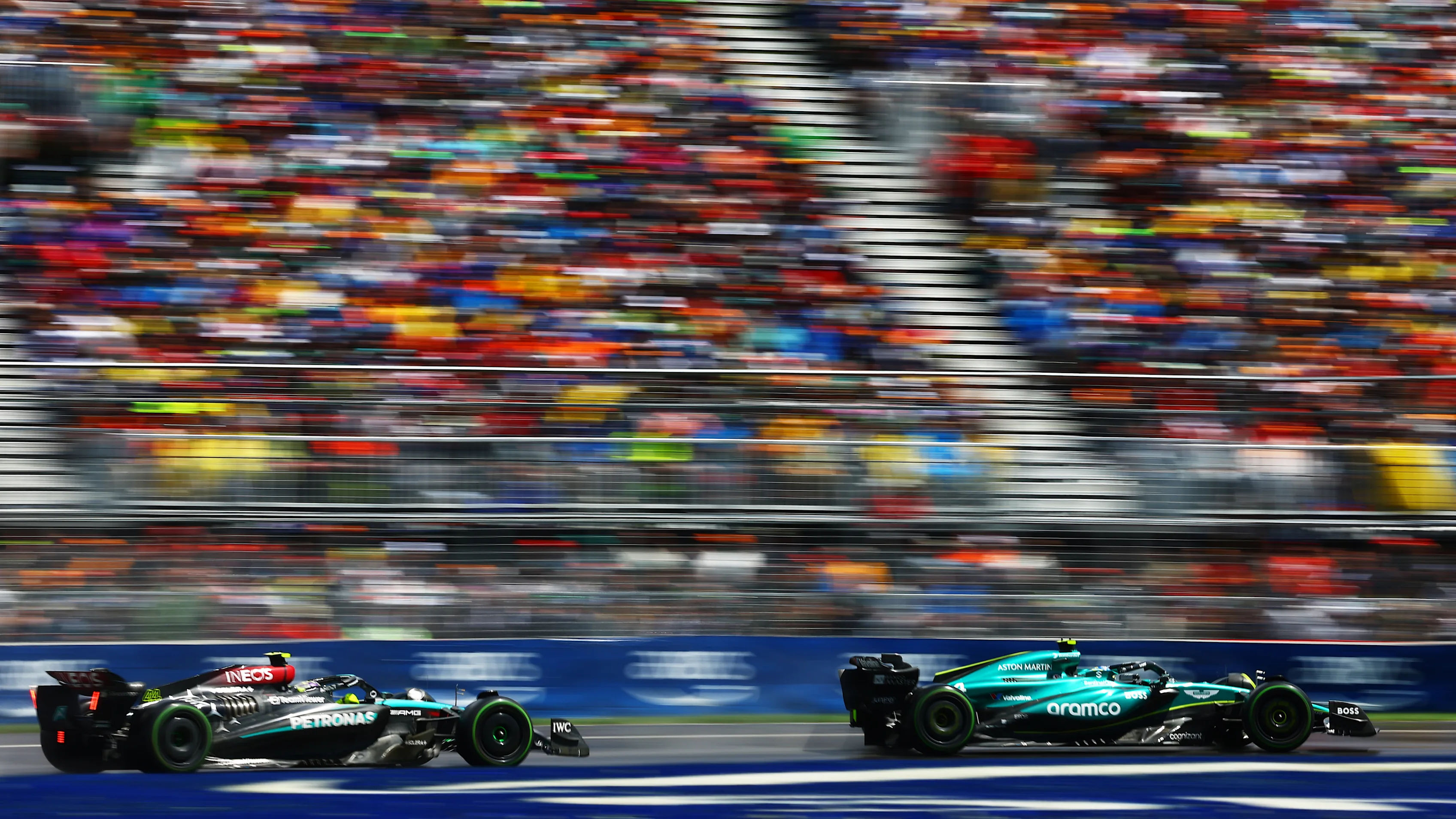 MONTREAL, QUEBEC - JUNE 09: Fernando Alonso of Spain driving the (14) Aston Martin AMR24 Mercedes leads Lewis Hamilton of Great Britain driving the (44) Mercedes AMG Petronas F1 Team W15 on track during the F1 Grand Prix of Canada at Circuit Gilles Villeneuve on June 09, 2024 in Montreal, Quebec. (Photo by Mark Thompson/Getty Images)