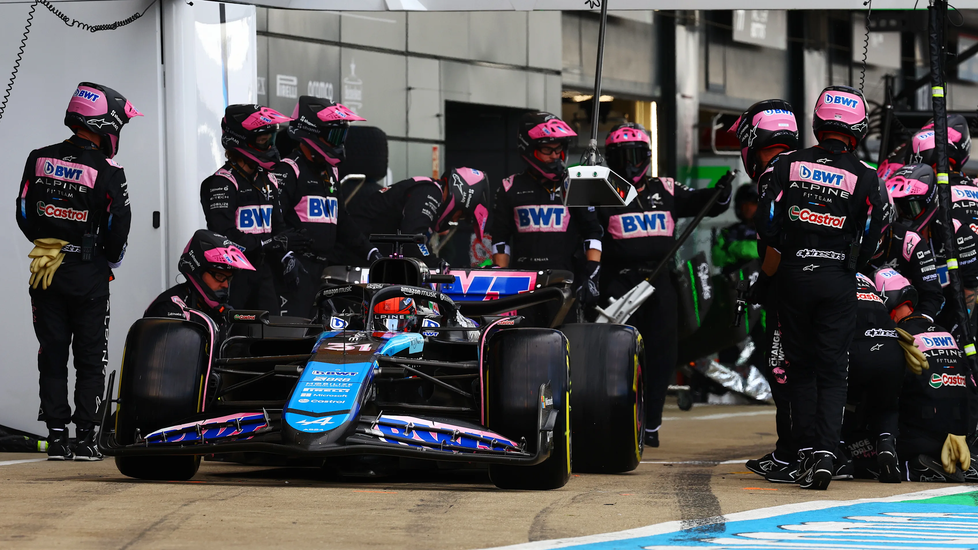 NORTHAMPTON, ENGLAND - JULY 07: Esteban Ocon of France driving the (31) Alpine F1 A524 Renault makes a pitstop during the F1 Grand Prix of Great Britain at Silverstone Circuit on July 07, 2024 in Northampton, England. (Photo by Mark Thompson/Getty Images)