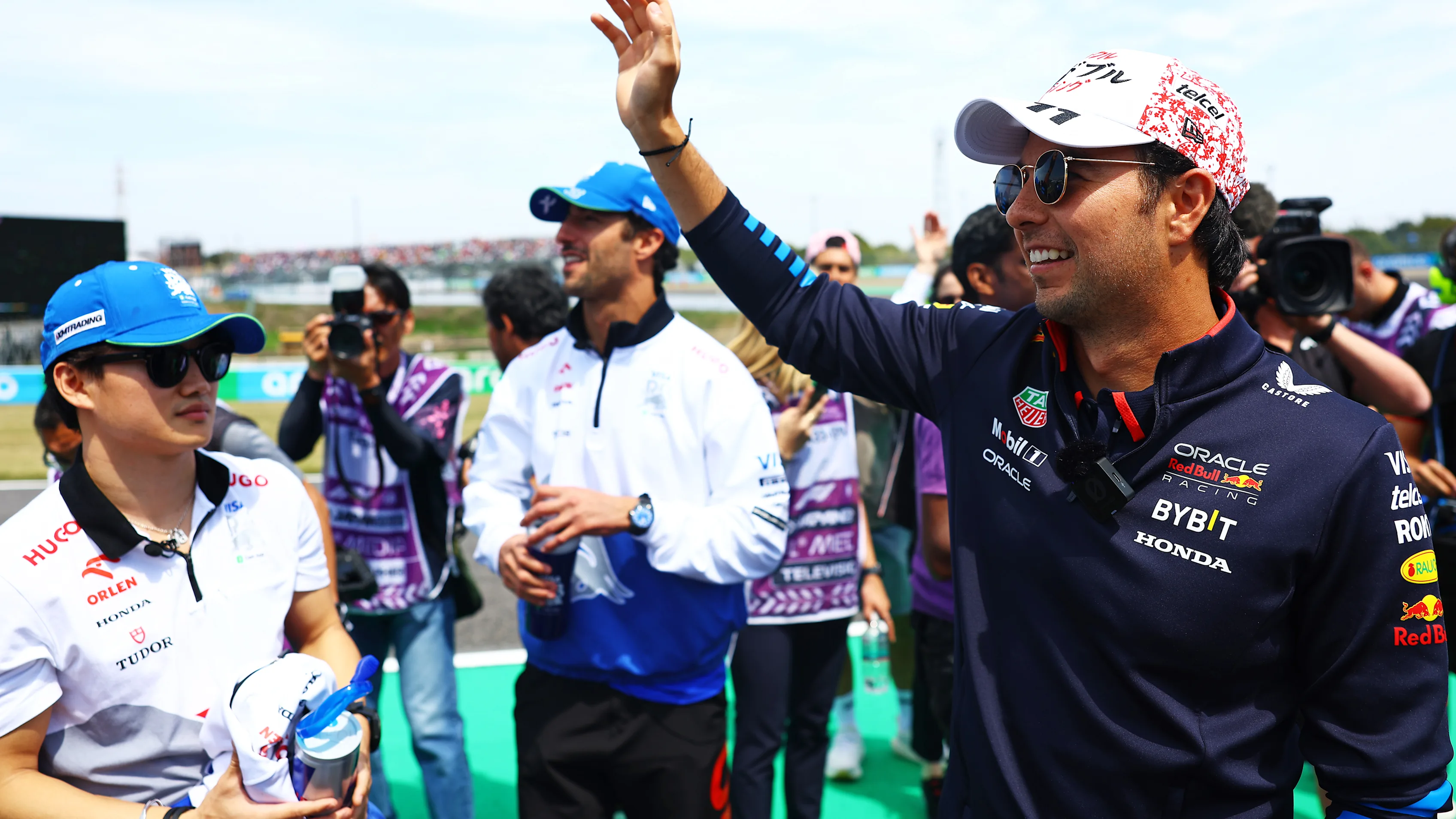 SUZUKA, JAPAN - APRIL 07: Sergio Perez of Mexico and Oracle Red Bull Racing waves to the crowd on