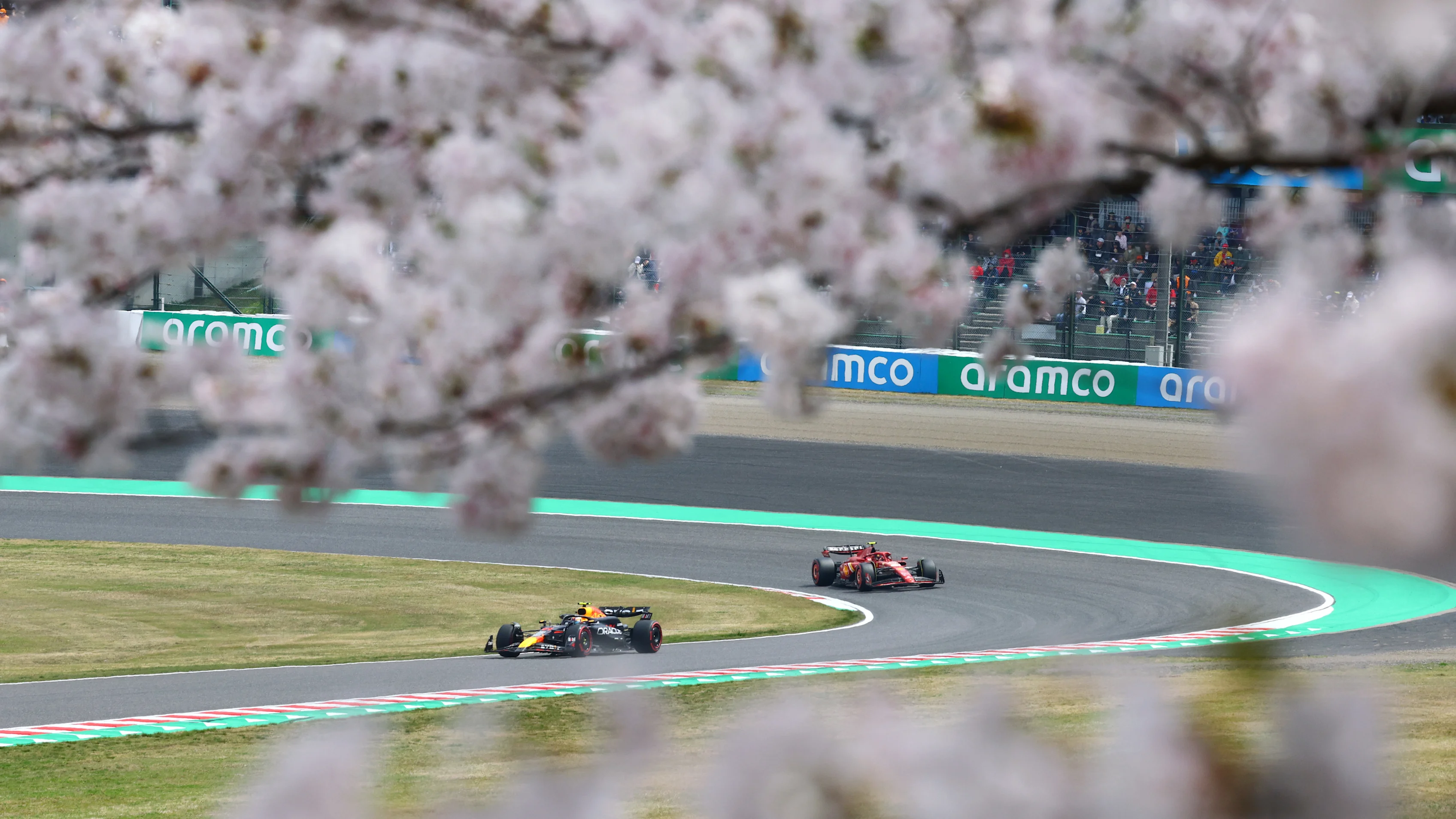 SUZUKA, JAPAN - APRIL 06: Sergio Perez of Mexico driving the (11) Oracle Red Bull Racing RB20 leads