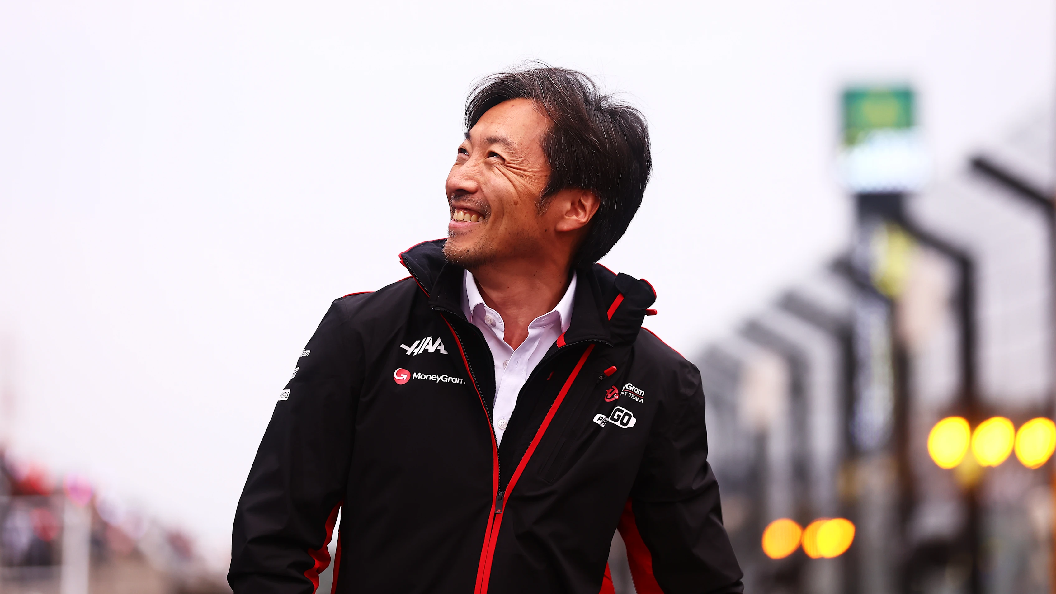 SUZUKA, JAPAN - APRIL 06: Haas F1 Team Principal Ayao Komatsu waves to the crowd after qualifying