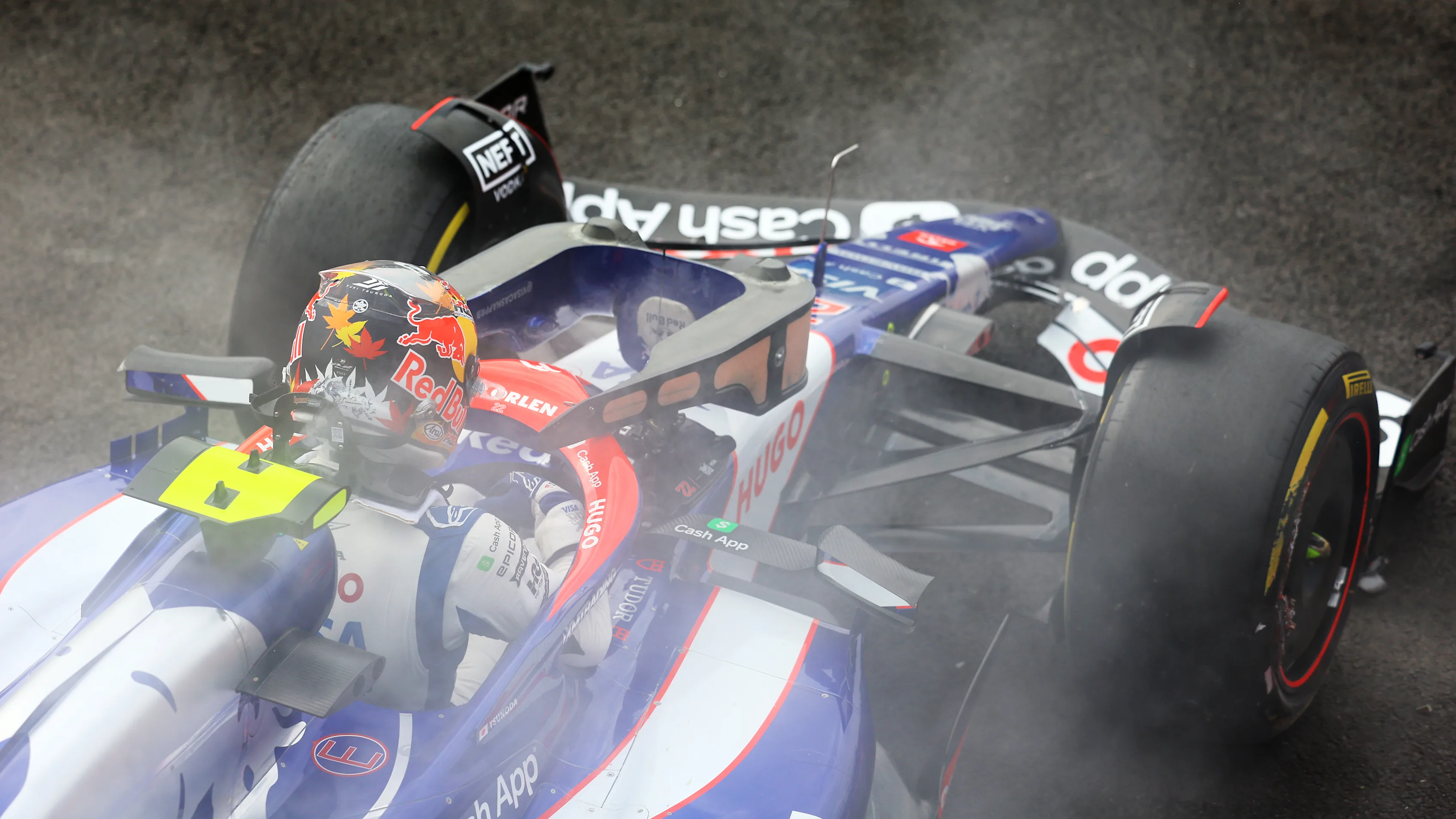 MEXICO CITY, MEXICO - OCTOBER 27: Yuki Tsunoda of Japan and Visa Cash App RB climbs out of his