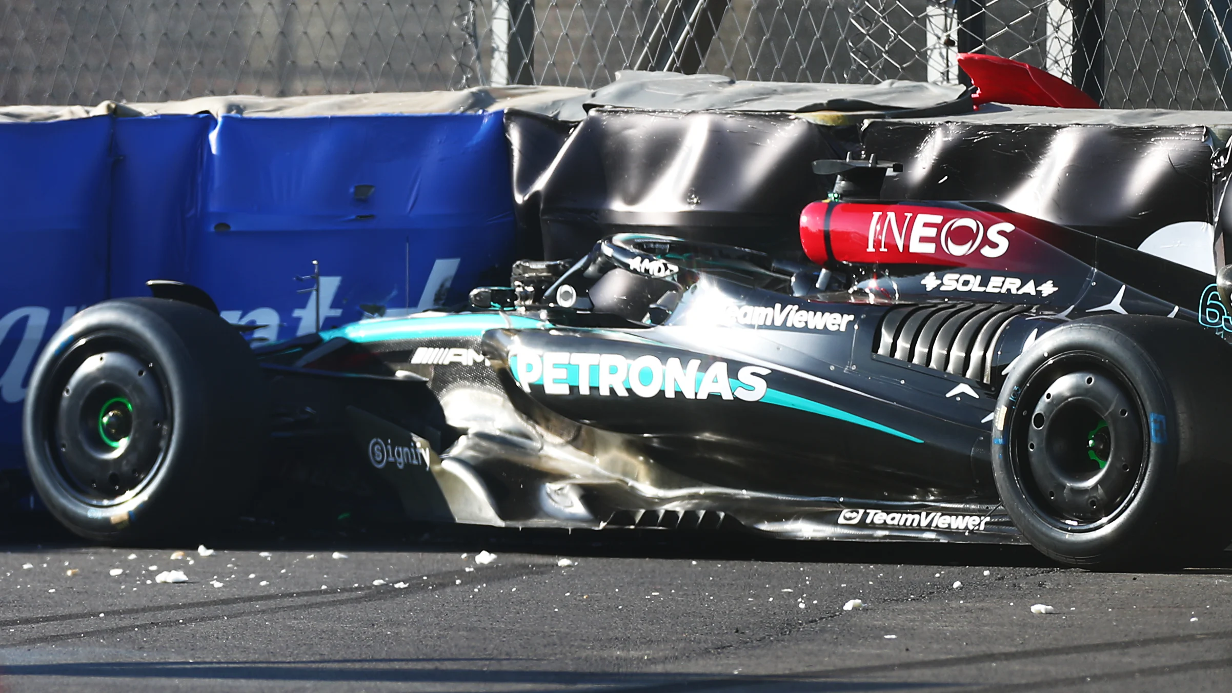 MEXICO CITY, MEXICO - OCTOBER 25: George Russell of Great Britain and Mercedes is helped to the The