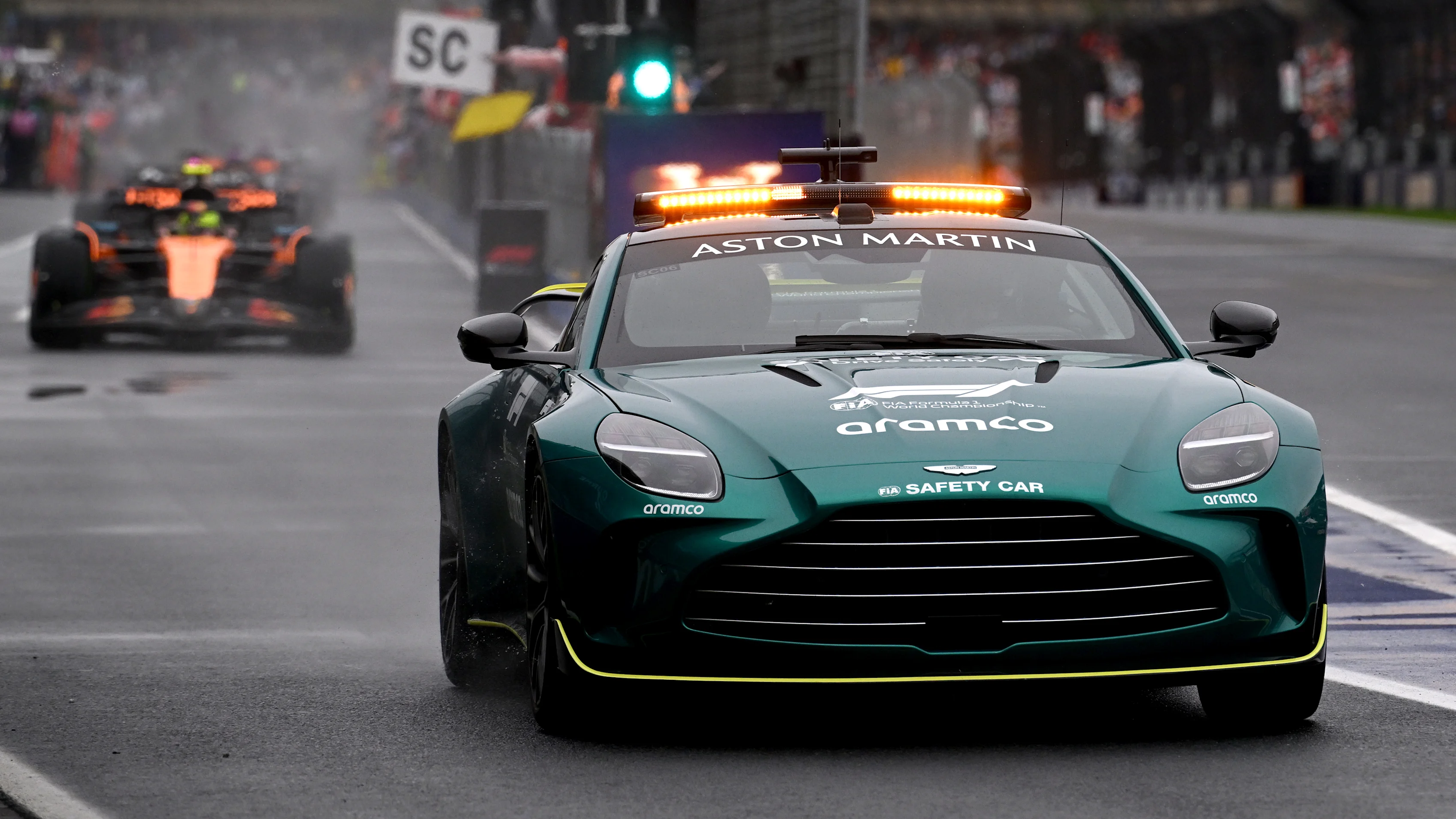 MELBOURNE, AUSTRALIA - MARCH 16: The FIA Safety Car leads Lando Norris of Great Britain driving the