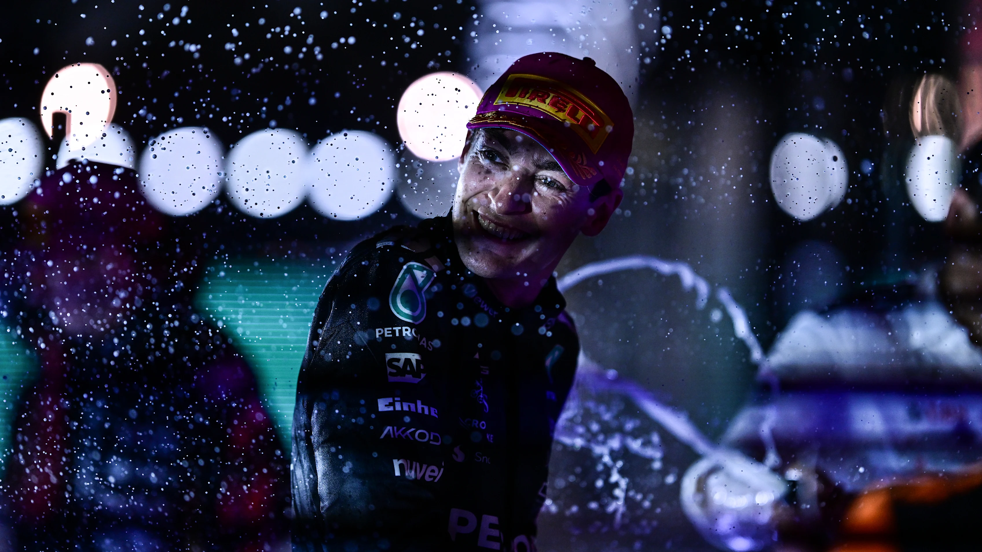 SINGAPORE, SINGAPORE - OCTOBER 05: Race winner George Russell of Great Britain and Mercedes AMG Petronas F1 Team celebrates with Champagne on the podium during the F1 Grand Prix of Singapore at Marina Bay Street Circuit on October 05, 2025 in Singapore, Singapore. (Photo by Mario Renzi - Formula 1/Formula 1 via Getty Images)