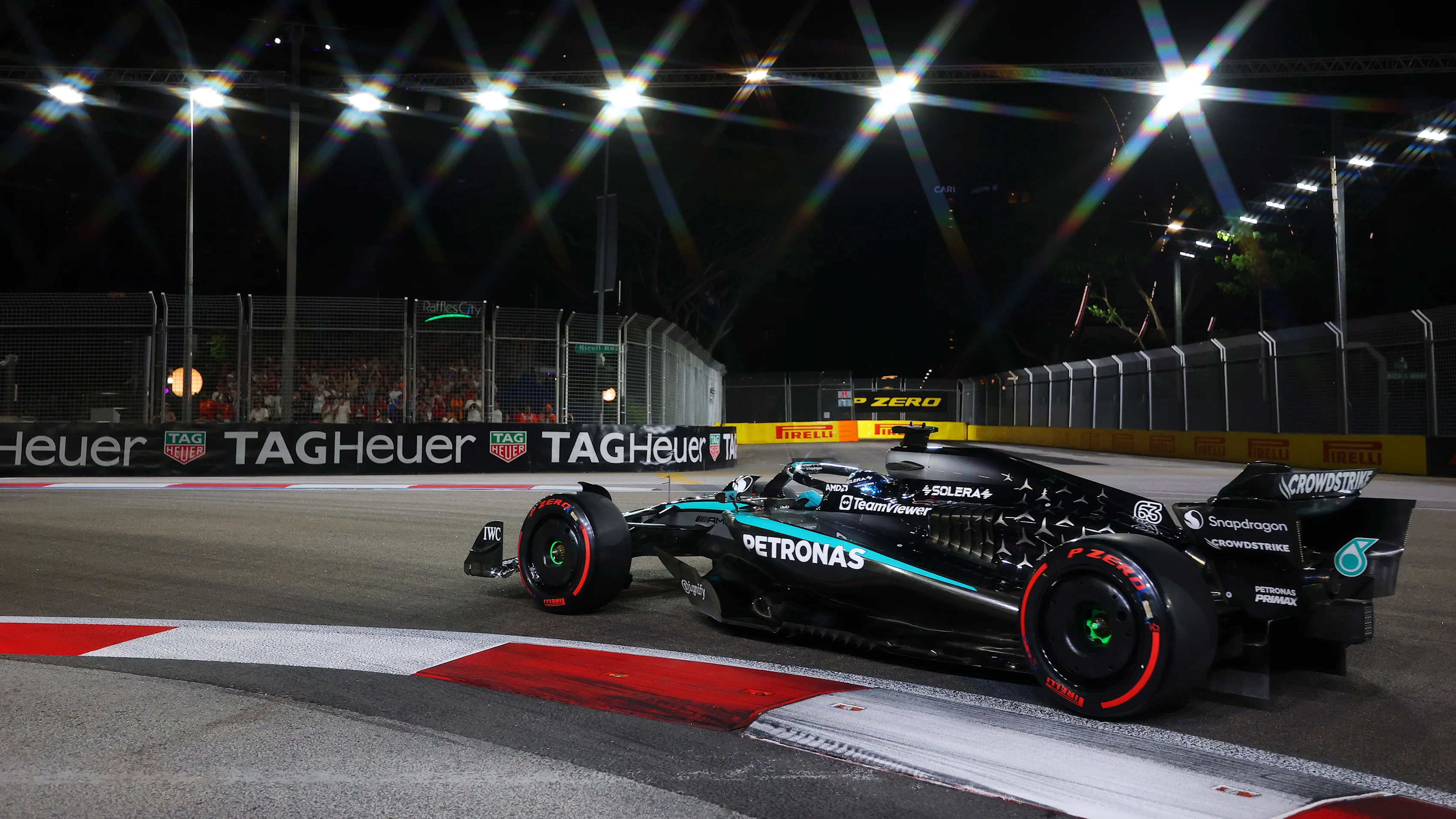 SINGAPORE, SINGAPORE - OCTOBER 04: George Russell of Great Britain driving the (63) Mercedes AMG