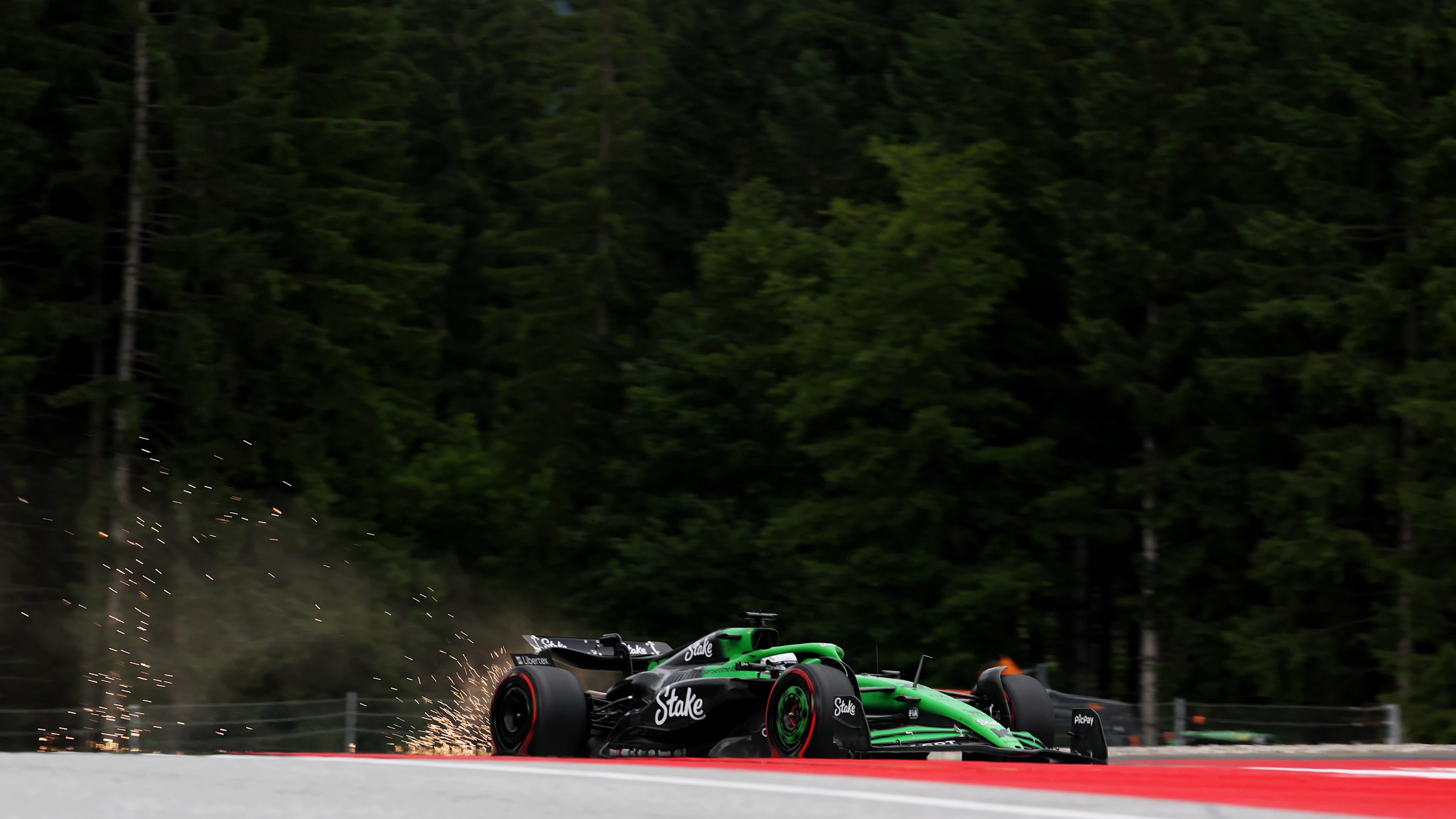 SPIELBERG, AUSTRIA - JUNE 27: Sparks fly behind Nico Hulkenberg of Germany driving the (27) Kick Sauber C45 Ferrari on track during practice ahead of the F1 Grand Prix of Austria at Red Bull Ring on June 27, 2025 in Spielberg, Austria. (Photo by Mark Thompson/Getty Images)