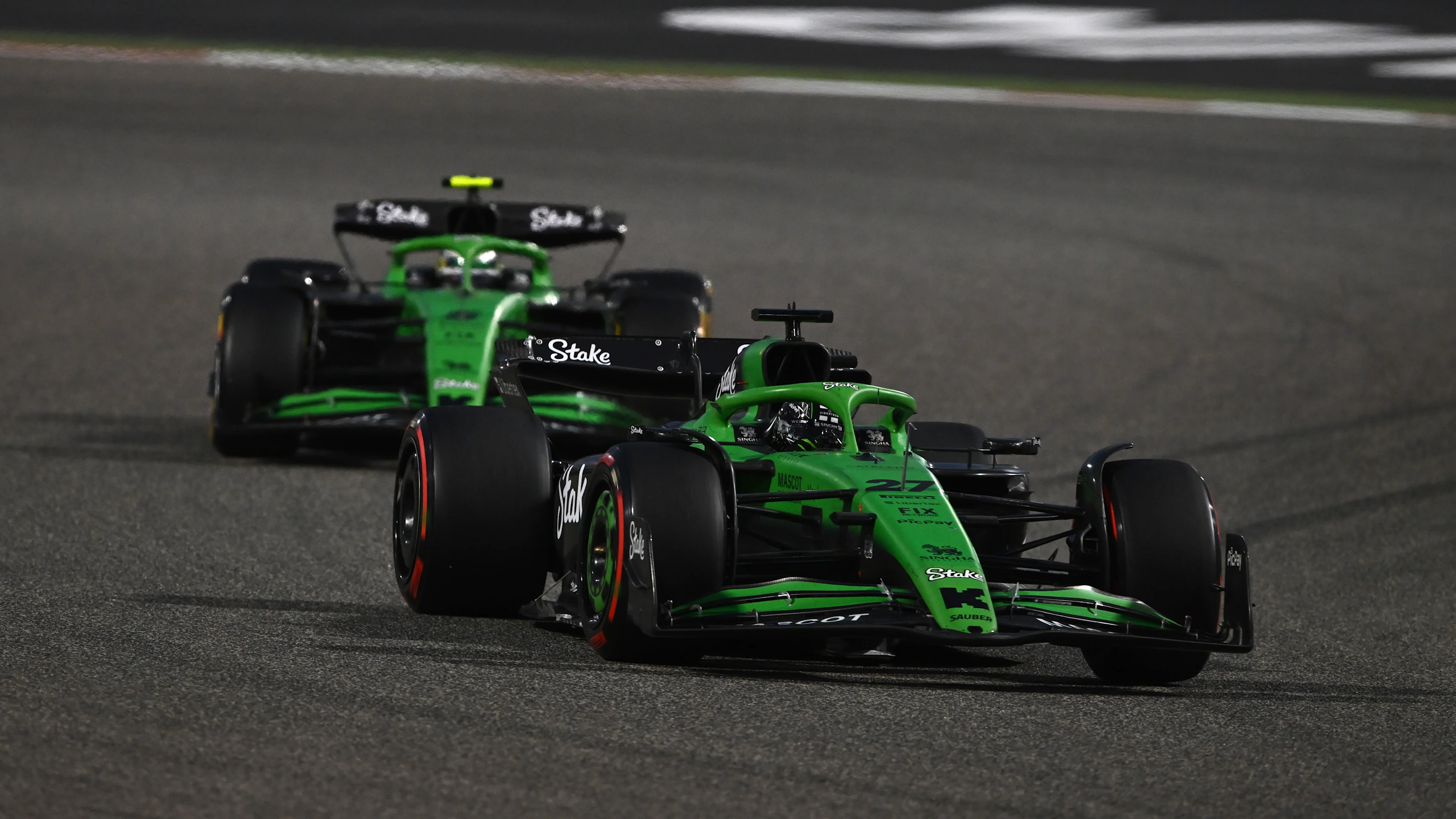 BAHRAIN, BAHRAIN - APRIL 13: Nico Hulkenberg of Germany driving the (27) Kick Sauber C45 Ferrari leads Gabriel Bortoleto of Brazil driving the (5) Kick Sauber C45 Ferrari on track during the F1 Grand Prix of Bahrain at Bahrain International Circuit on April 13, 2025 in Bahrain, Bahrain. (Photo by Rudy Carezzevoli/Getty Images)