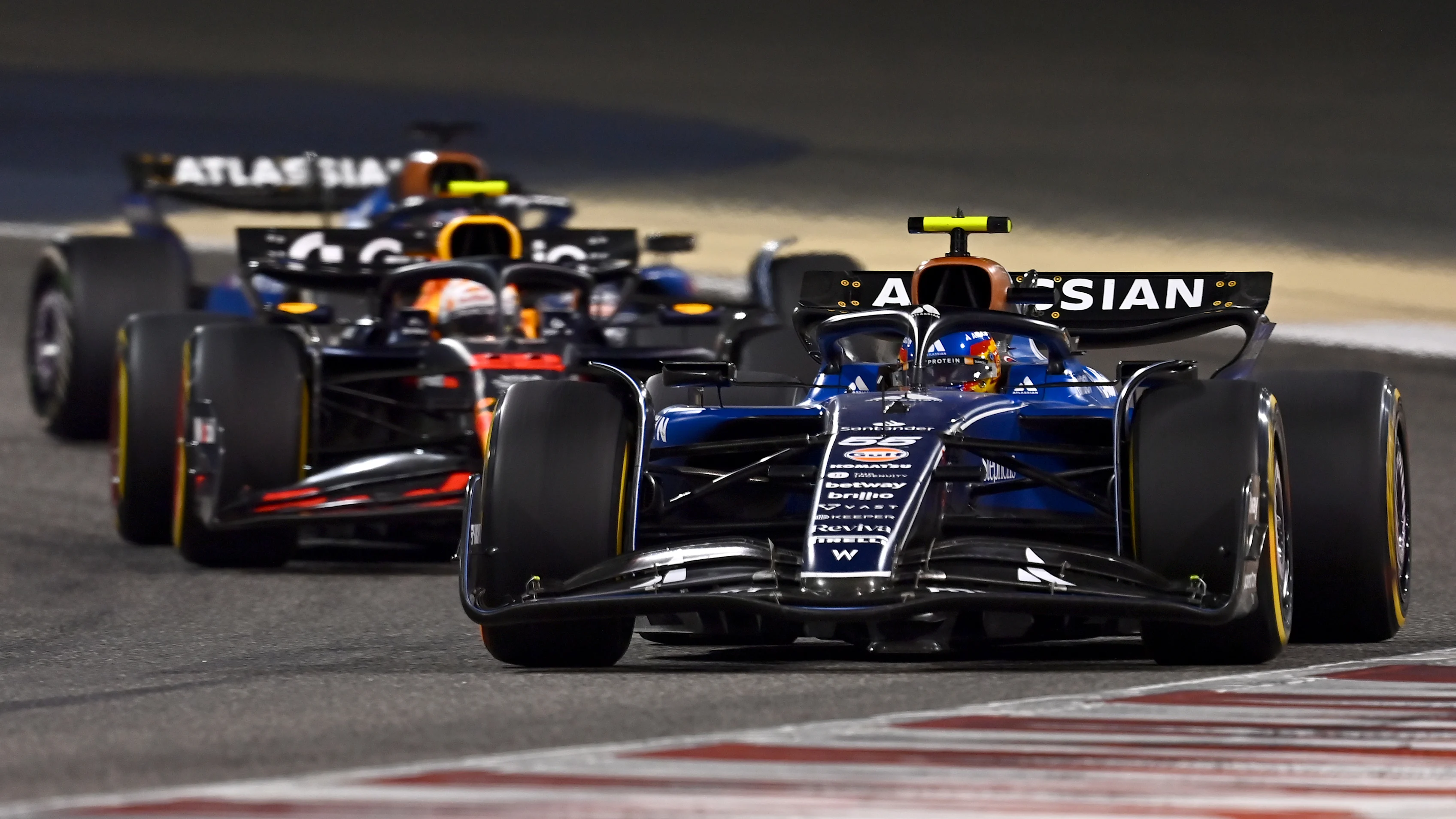 BAHRAIN, BAHRAIN - APRIL 13: Carlos Sainz of Spain driving the (55) Williams FW47 Mercedes leads
