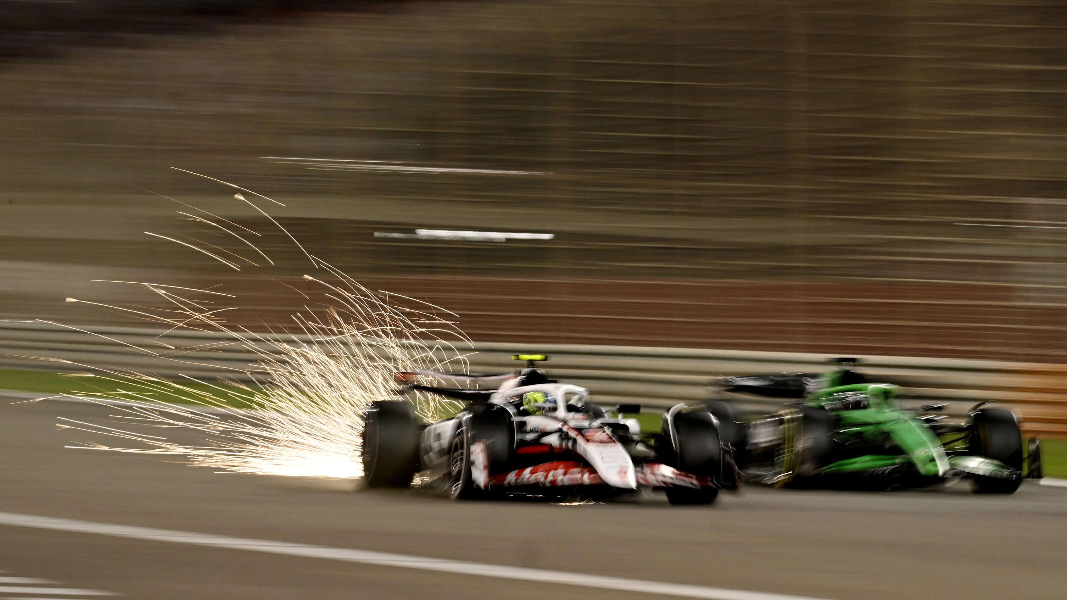 BAHRAIN, BAHRAIN - APRIL 13: Sparks fly behind from Oliver Bearman of Great Britain driving the