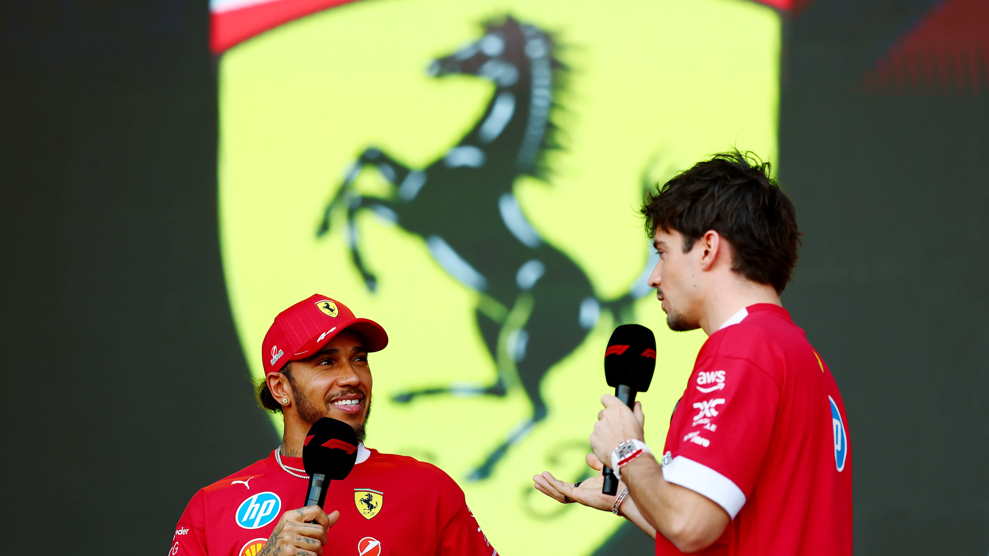 BAHRAIN, BAHRAIN - APRIL 12: Lewis Hamilton of Great Britain and Scuderia Ferrari and Charles