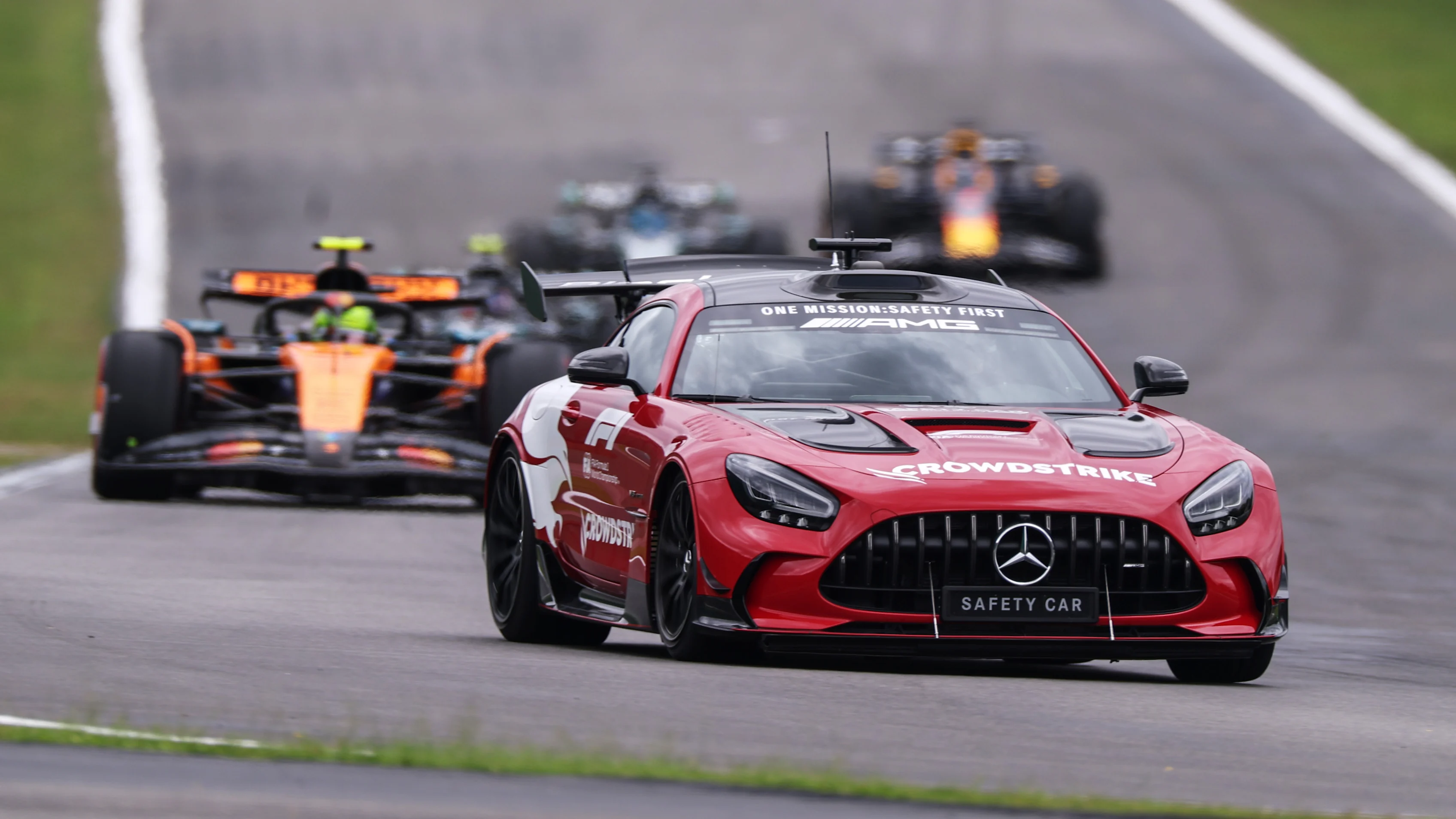 SAO PAULO, BRAZIL - NOVEMBER 08: The FIA Safety Car leads Lando Norris of Great Britain driving the