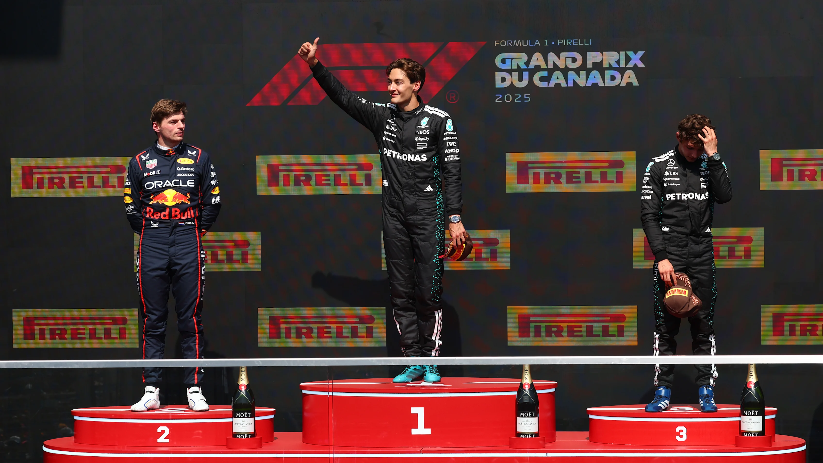 George Russell, Max Verstappen and Andrea Kimi Antonelli stand on the podium during the F1 Grand Prix of Canada at Circuit Gilles-Villeneuve on June 15, 2025 in Montreal, Quebec. (Photo by Clive Rose/Getty Images)