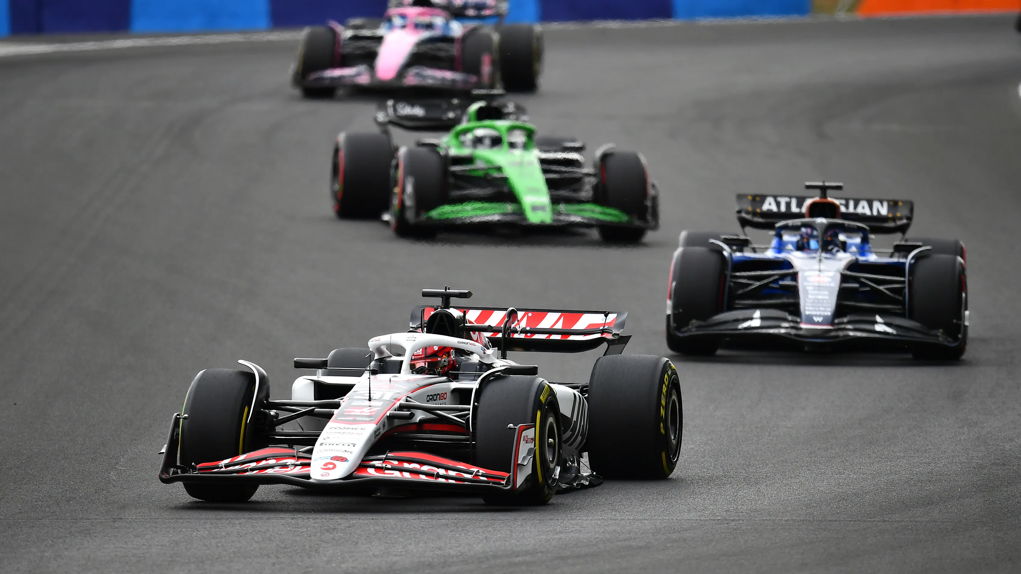 BUDAPEST, HUNGARY - AUGUST 03: Esteban Ocon of France driving the (31) Haas F1 VF-25 Ferrari leads