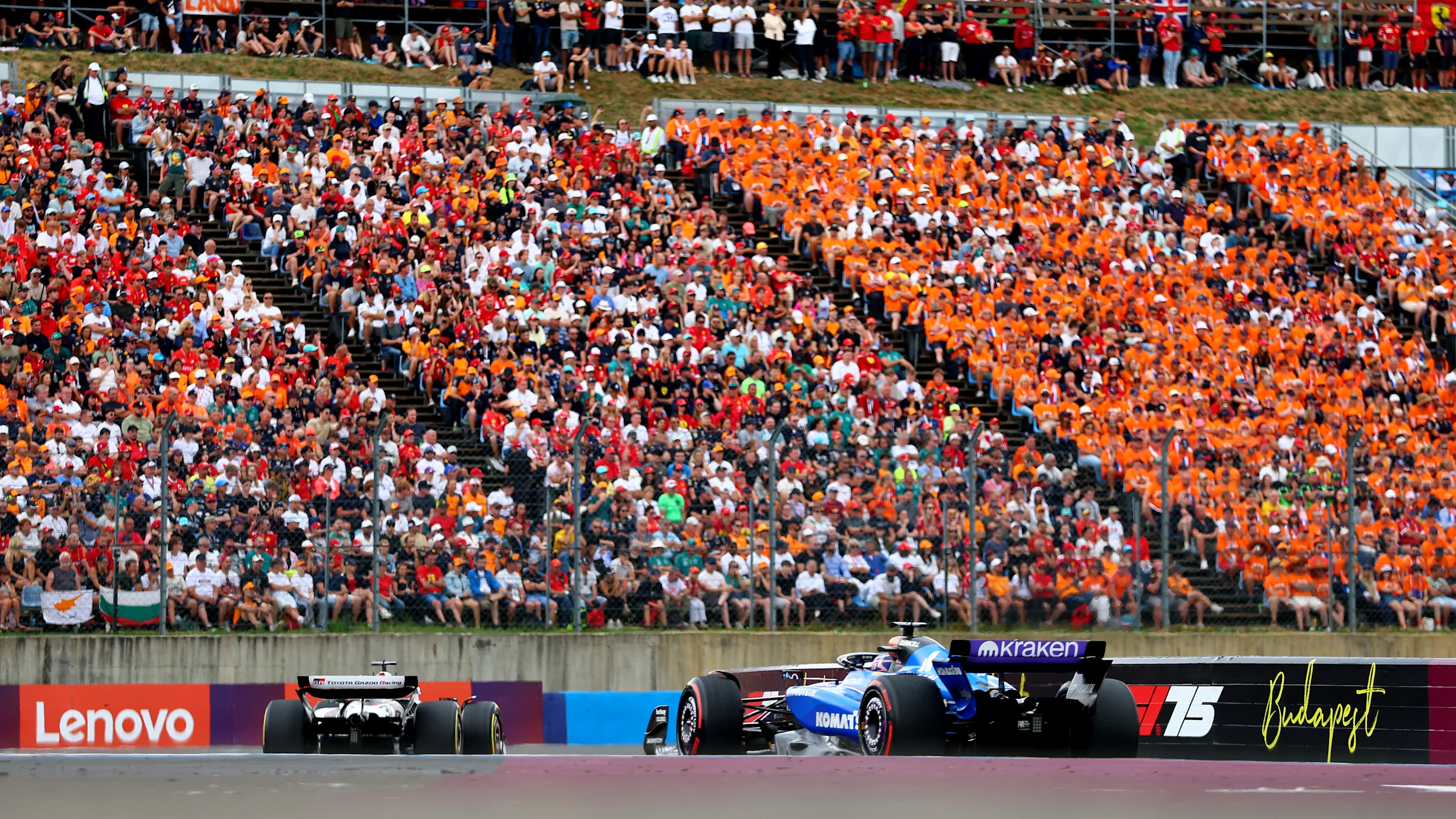 BUDAPEST, HUNGARY - AUGUST 03: Esteban Ocon of France driving the (31) Haas F1 VF-25 Ferrari leads Alexander Albon of Thailand driving the (23) Williams FW47 Mercedes on track during the F1 Grand Prix of Hungary at Hungaroring on August 03, 2025 in Budapest, Hungary. (Photo by Bryn Lennon - Formula 1/Formula 1 via Getty Images)