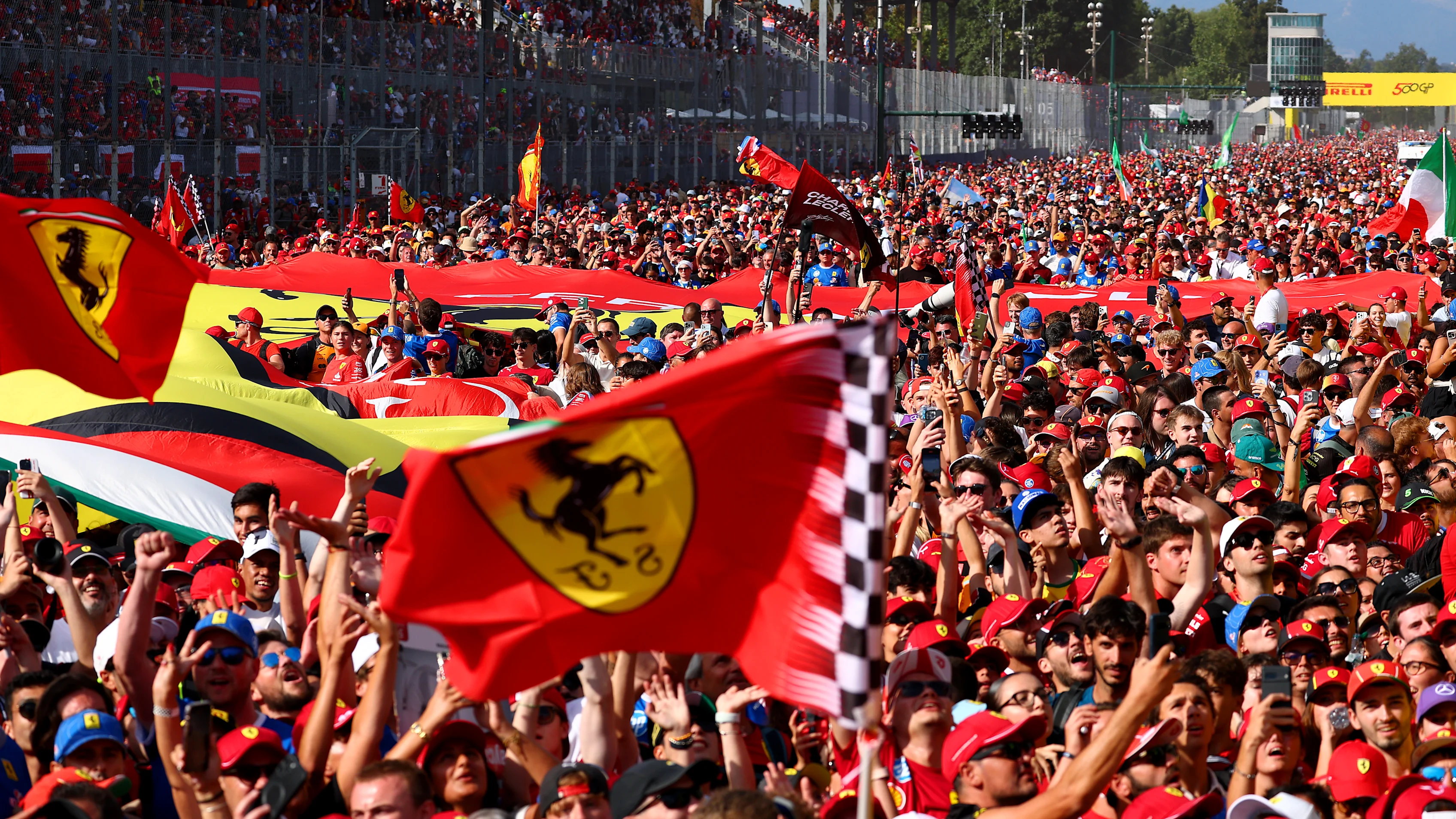 MONZA, ITALY - SEPTEMBER 07: Fans flood the track after the race for the podium ceremony during the