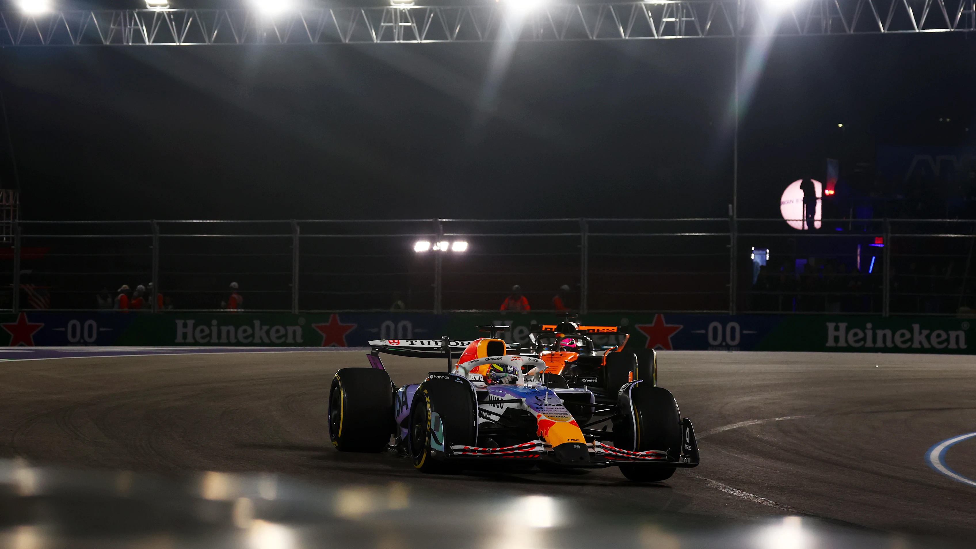 LAS VEGAS, NEVADA - NOVEMBER 22: Isack Hadjar of France driving the (6) Visa Cash App Racing Bulls VCARB 02 leads Oscar Piastri of Australia driving the (81) McLaren MCL39 Mercedes on track during the F1 Grand Prix of Las Vegas at Las Vegas Strip Circuit on November 22, 2025 in Las Vegas, Nevada. (Photo by Mark Thompson/Getty Images)