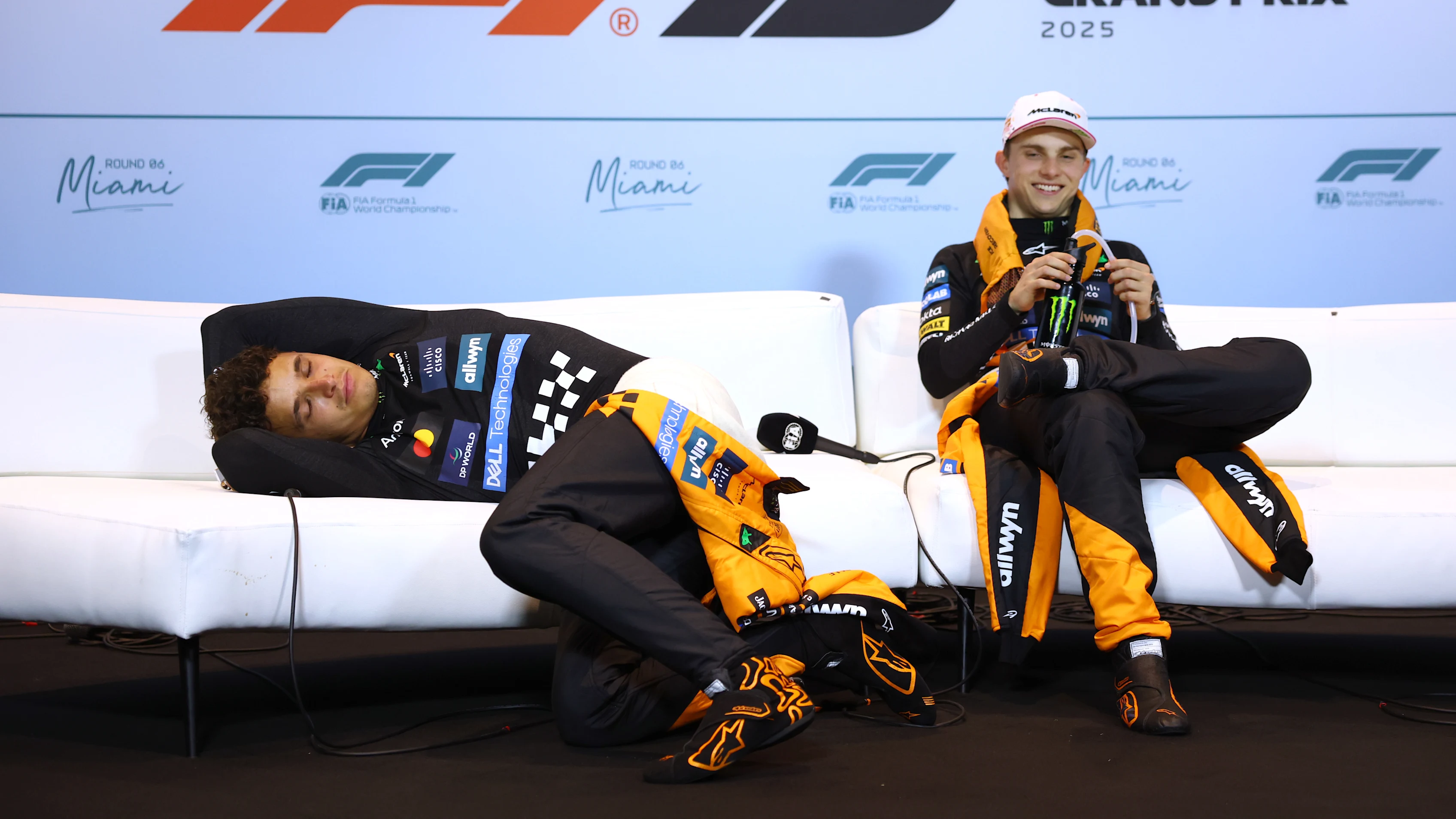 MIAMI, FLORIDA - MAY 04: Second placed Lando Norris of Great Britain and McLaren lays down in the