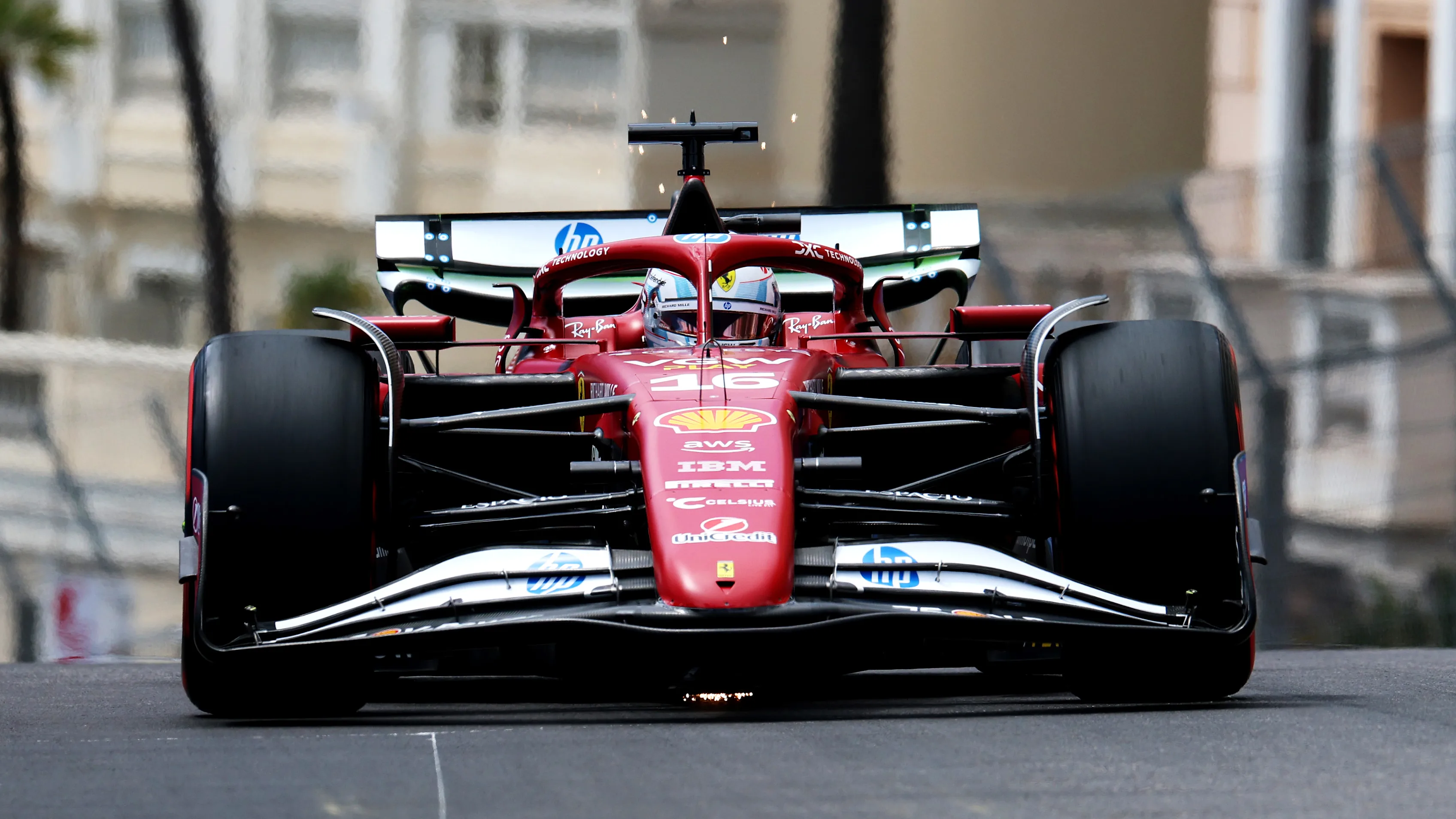 MONTE-CARLO, MONACO - MAY 23: Sparks fly behind Charles Leclerc of Monaco driving the (16) Scuderia
