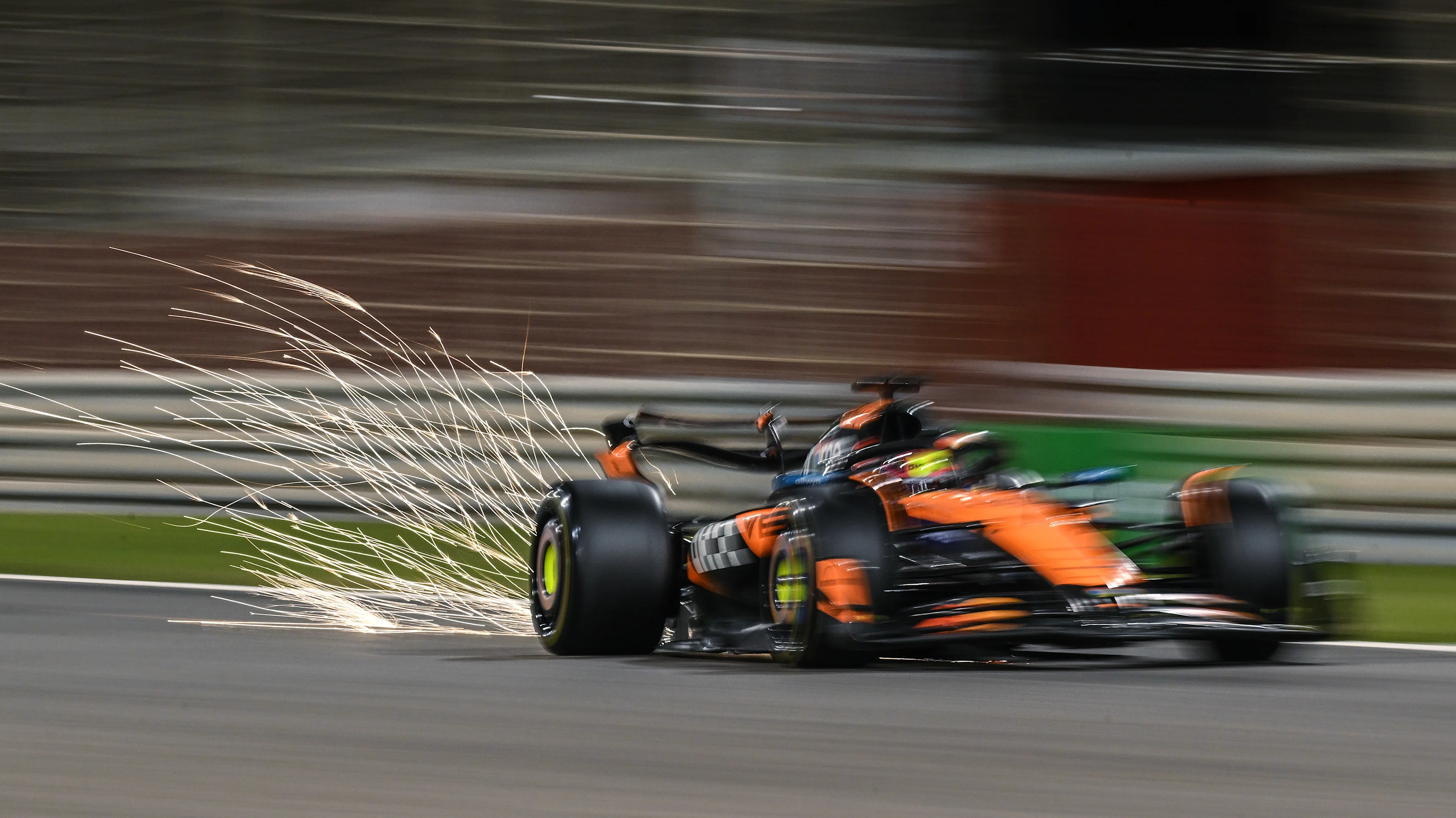 BAHRAIN, BAHRAIN - FEBRUARY 28: Sparks fly behind Oscar Piastri of Australia driving the (81)