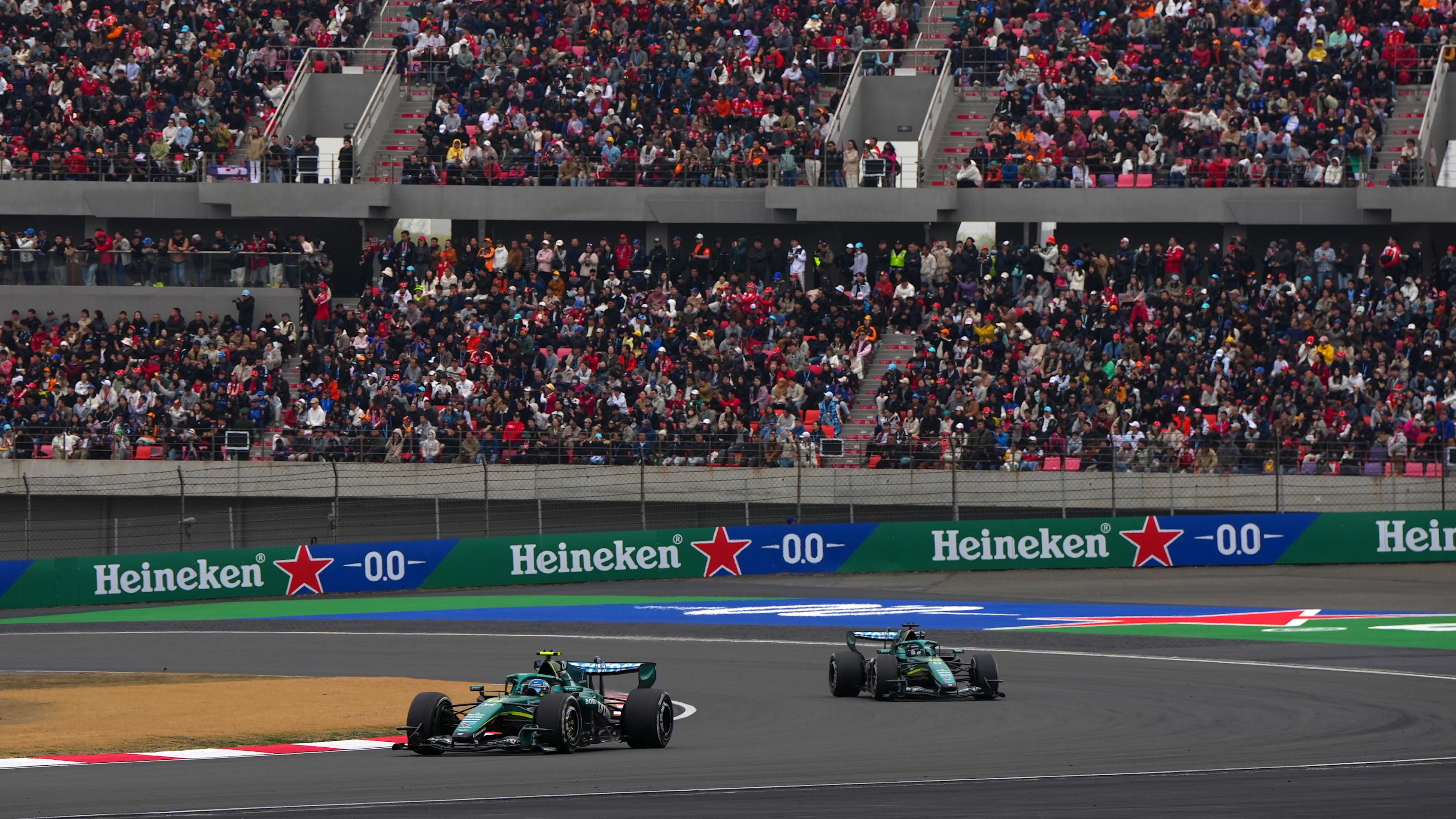 SHANGHAI, CHINA - MARCH 15: Fernando Alonso of Spain driving the (14) Aston Martin F1 Team AMR26 Honda leads Lance Stroll of Canada driving the (18) Aston Martin F1 Team AMR26 Honda on track during the F1 Grand Prix of China at Shanghai International Circuit on March 15, 2026 in Shanghai, China. (Photo by Alex Bierens de Haan/Getty Images)