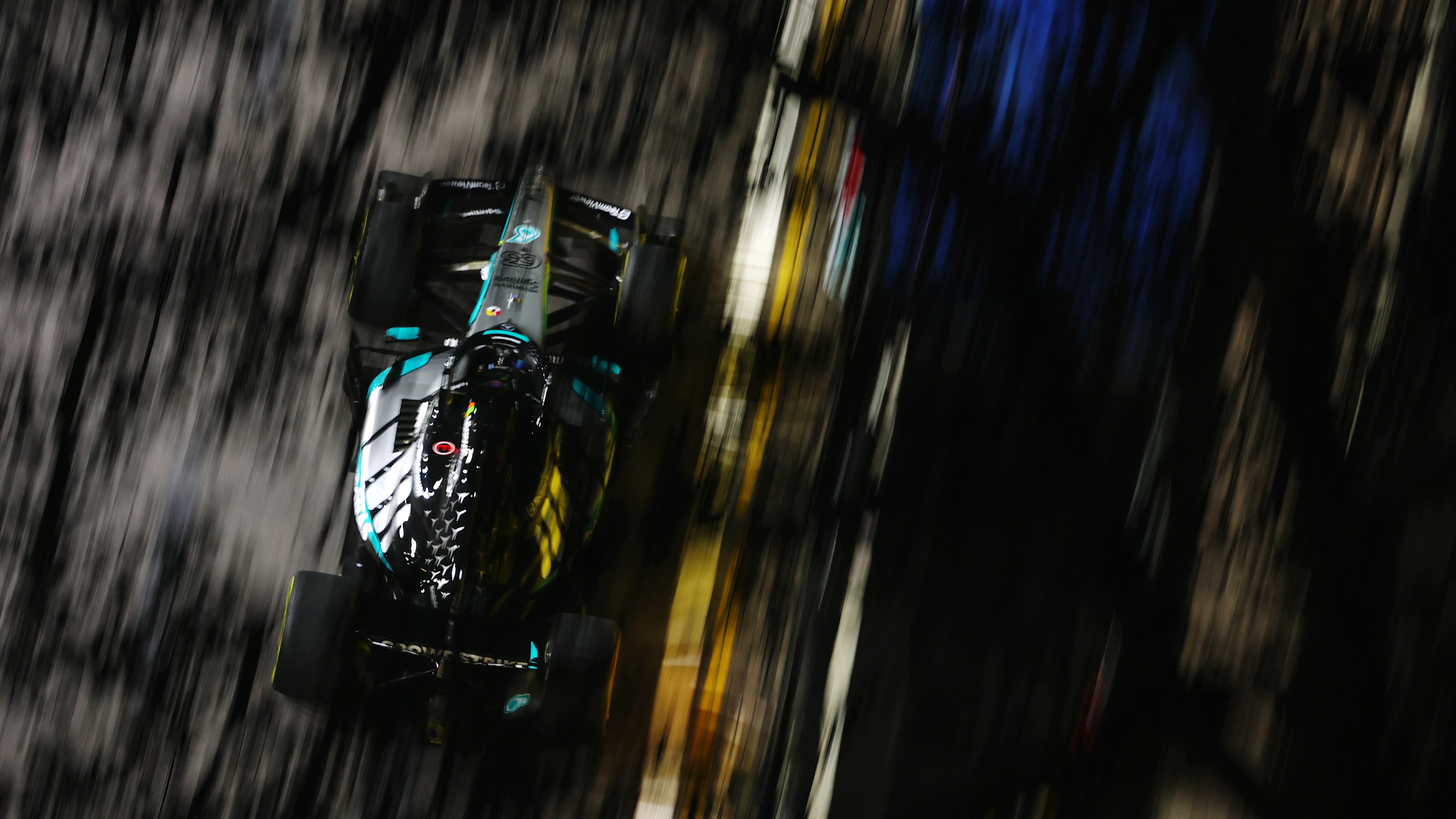 SINGAPORE, SINGAPORE - OCTOBER 09: George Russell of Great Britain driving the (63) Mercedes AMG