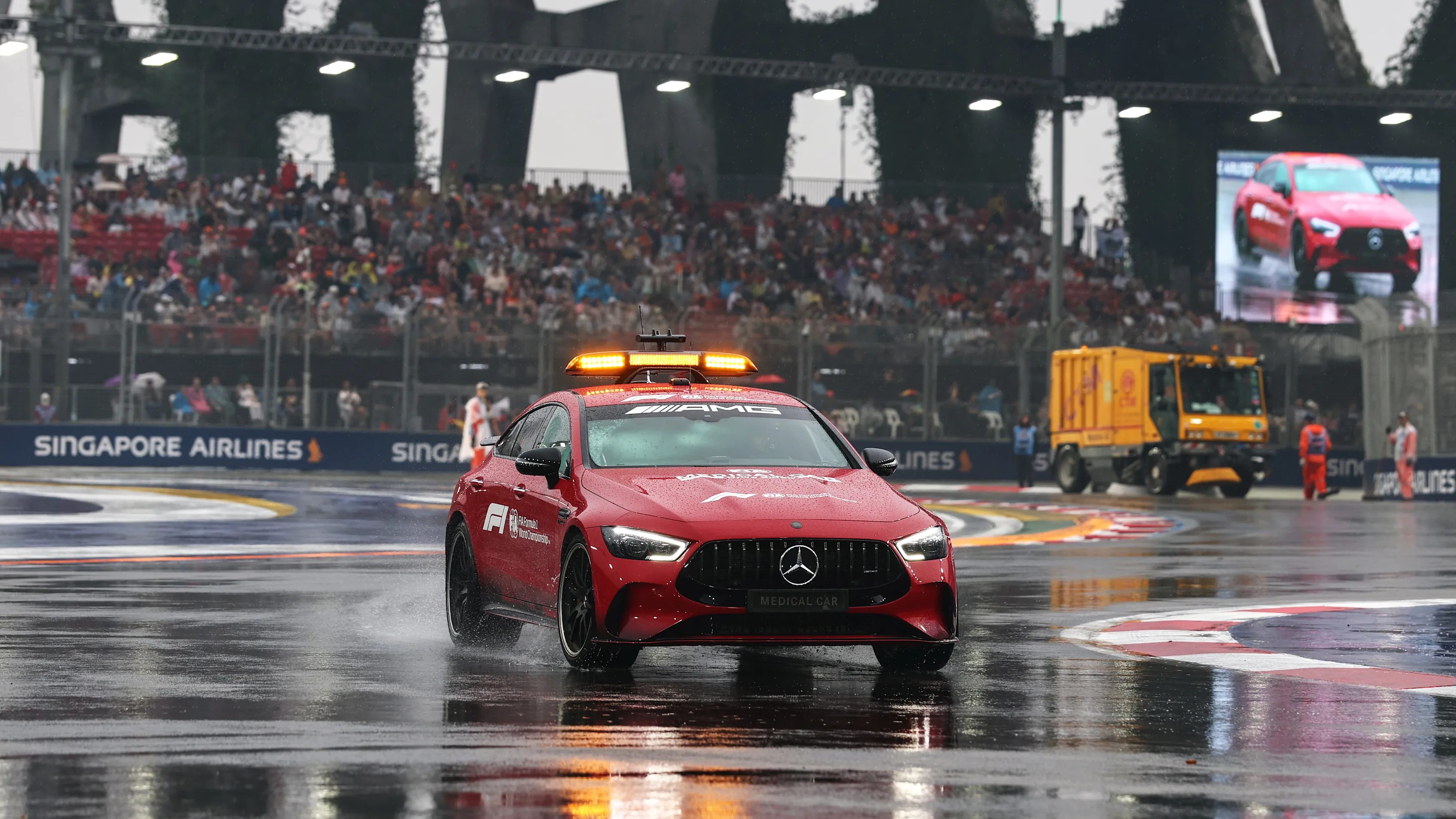 SINGAPORE, SINGAPORE - OCTOBER 10: The FIA Medical Car inspects the track for standing water prior