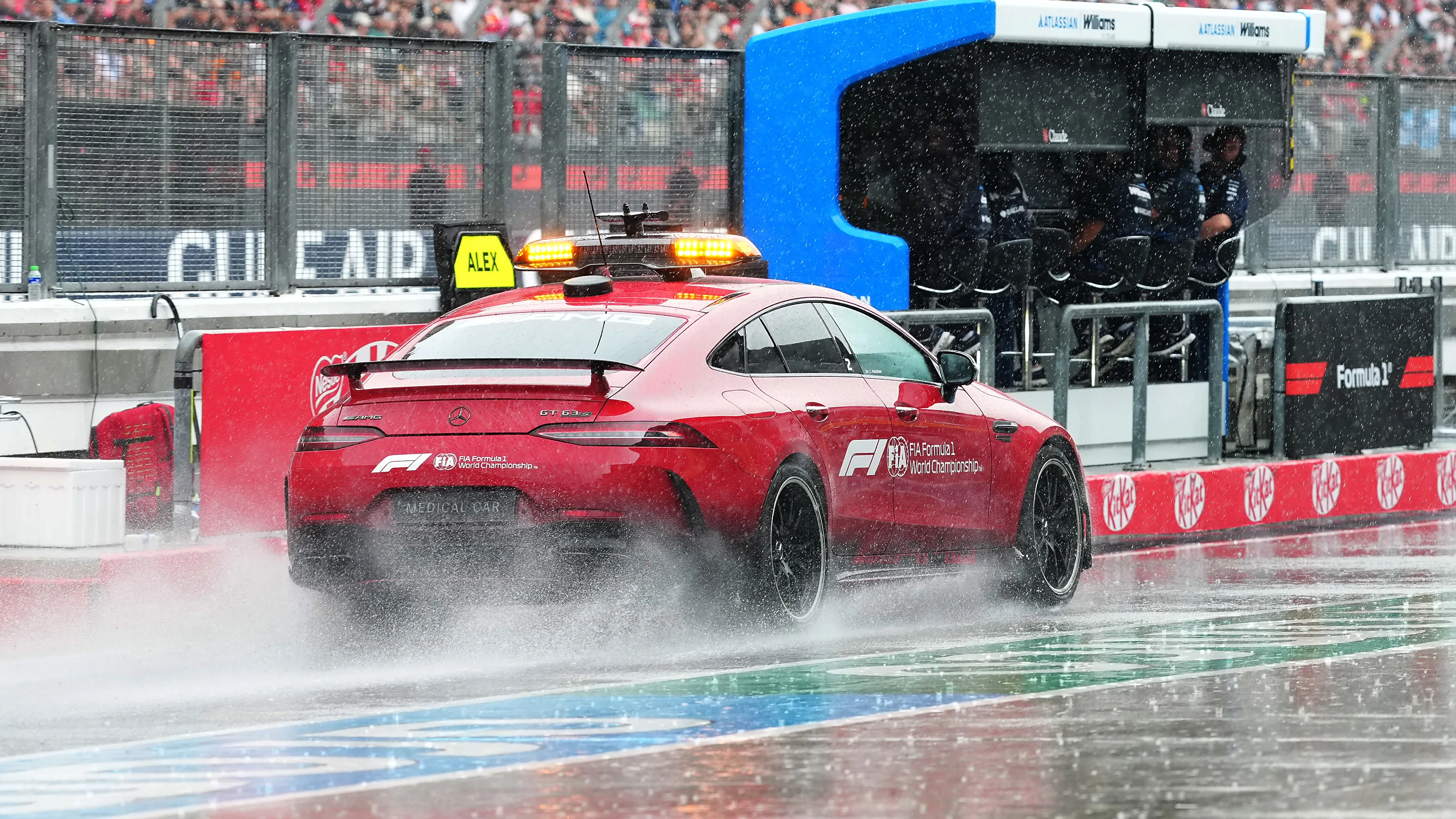 KUALA LUMPUR, MALAYSIA - OCTOBER 04: The FIA Medical Car kicks up spray in the Pitlane prior to the