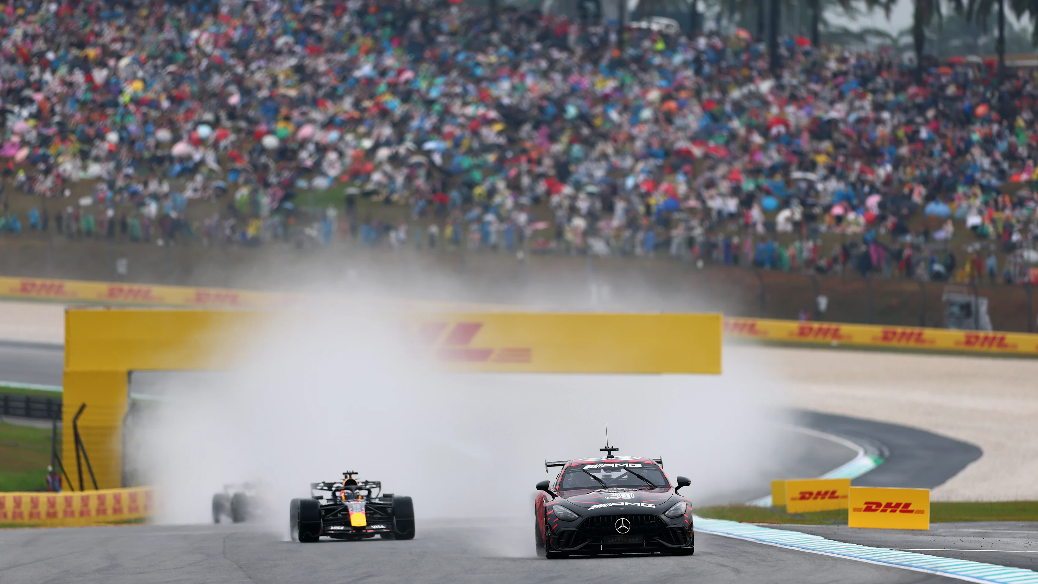 KUALA LUMPUR, MALAYSIA - OCTOBER 04: The FIA Safety Car leads Max Verstappen of the Netherlands